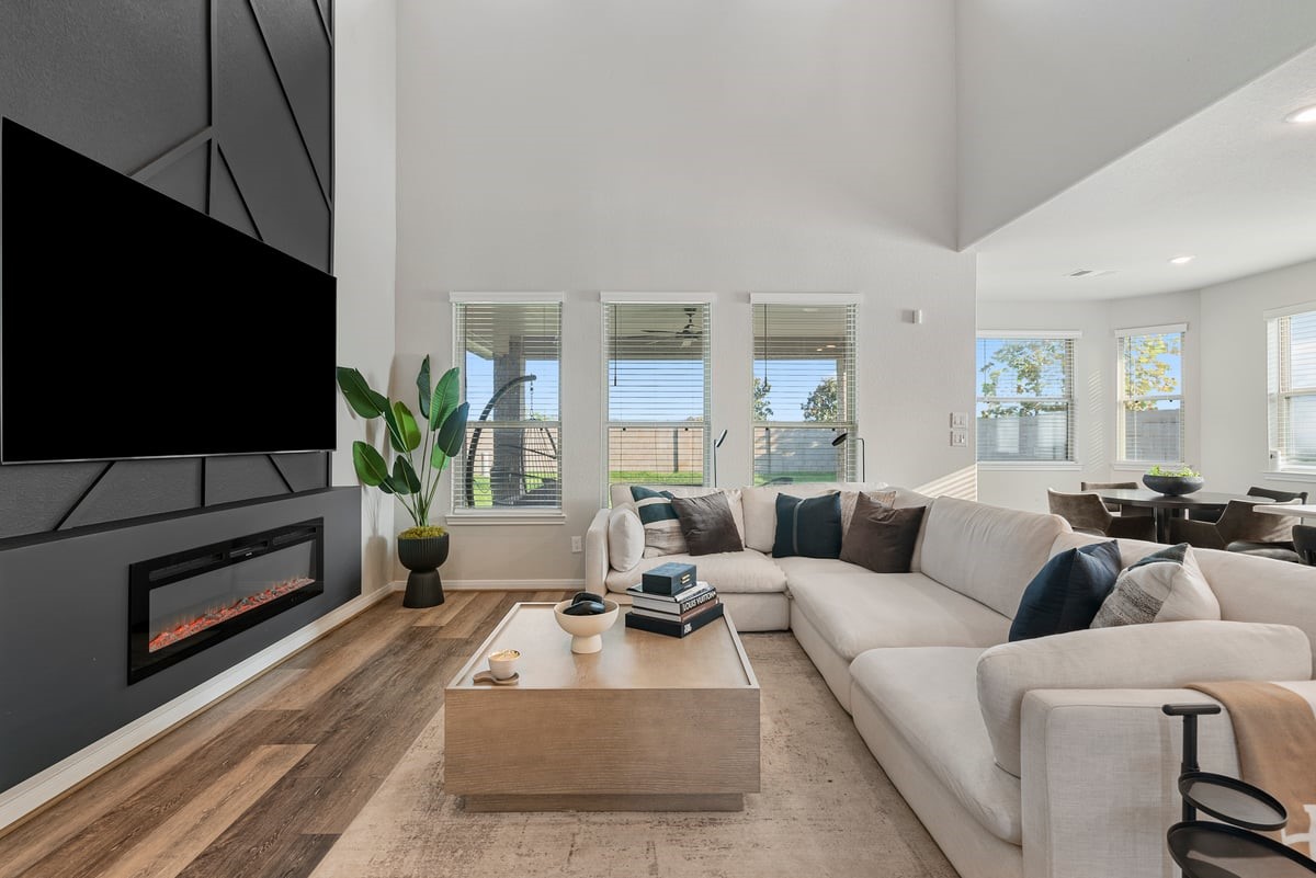 Enjoy the views of the backyard with bright windows from every angle! Soaring ceilings fills this space with natural light!