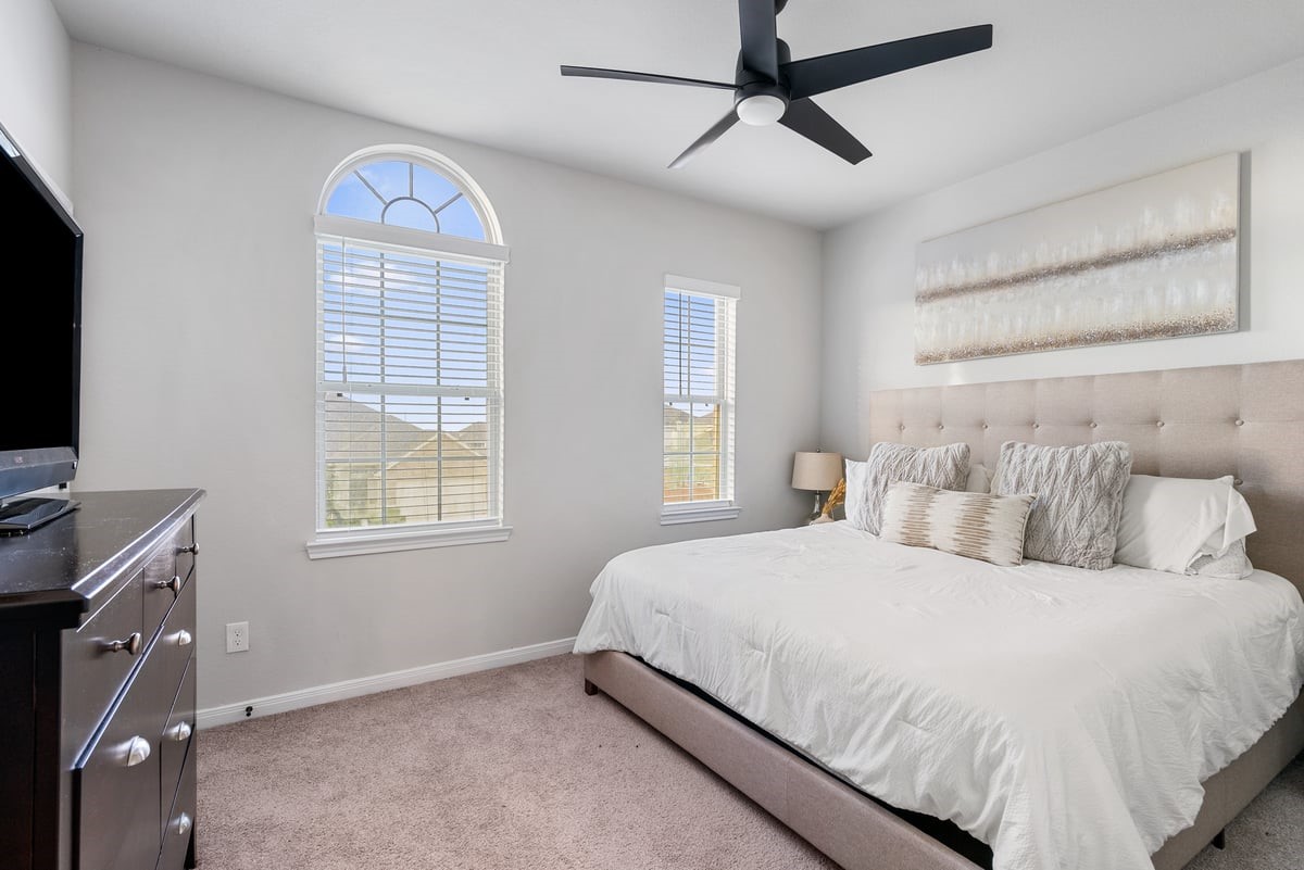Unique features are found throughout this home! Notice the beautiful arched windows in this spacious secondary bedroom!