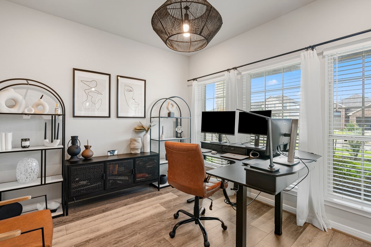 The private office is conveniently located at the front of the home, and offers picturesque views into the front yard! Updated light fixture provide a stylish touch!