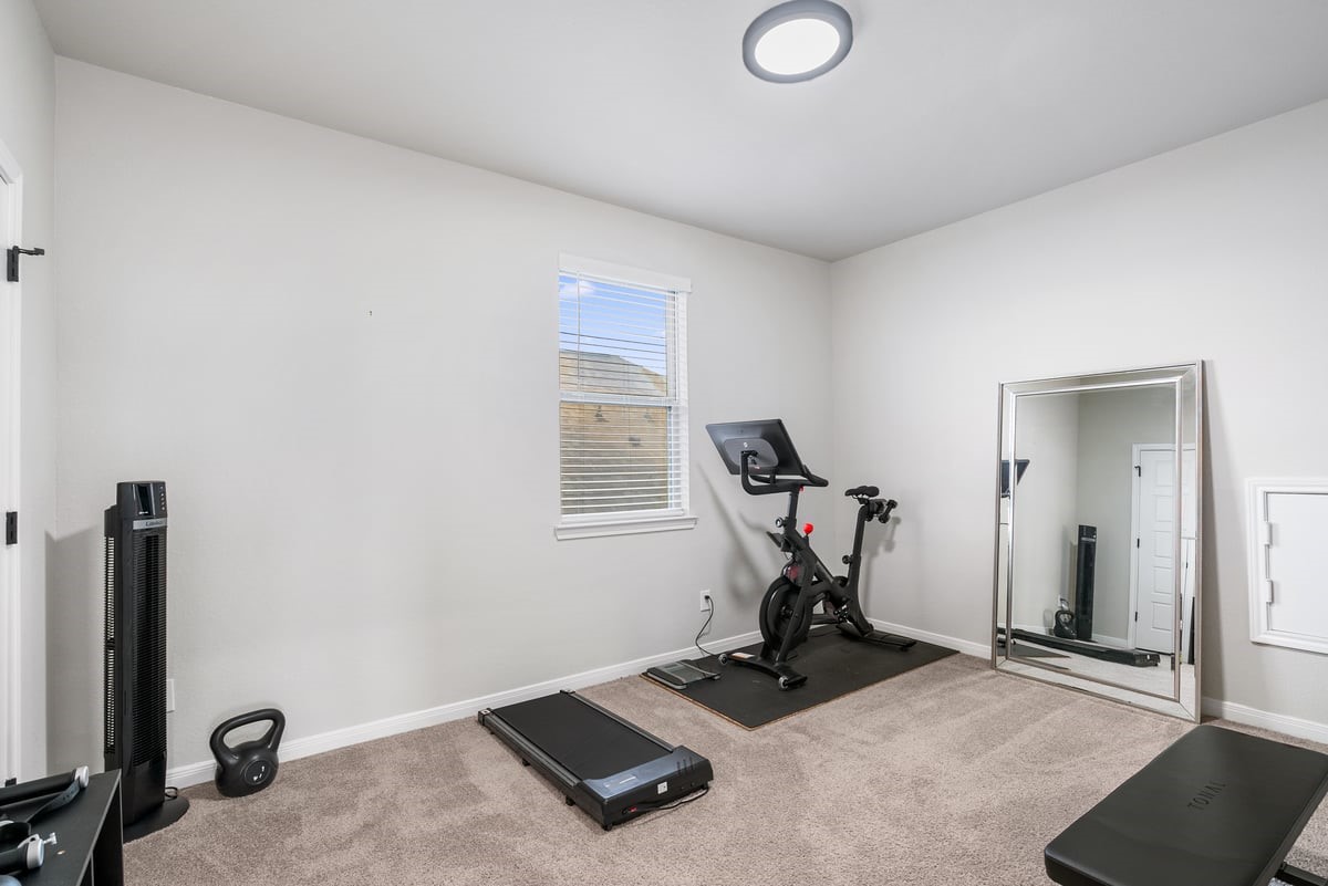 This bedroom is currently being used as a gym, demonstrating the versatility of this home!