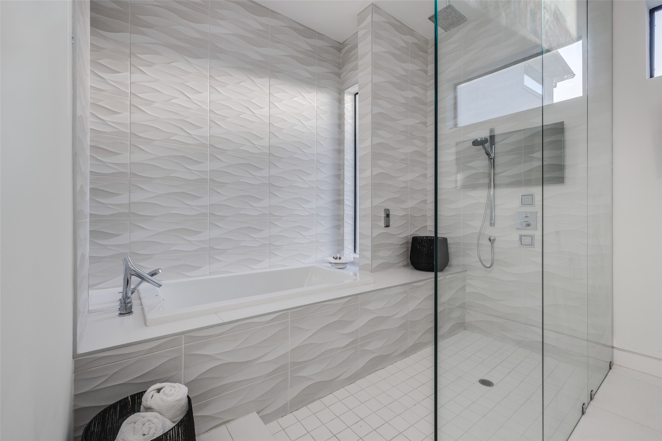 The massive Primary spa bathroom is a serene sanctuary finished with designer touches, in ceiling speakers, spacious shower, a private water closet & a soothing freestanding soaking tub. Lots of natural light.