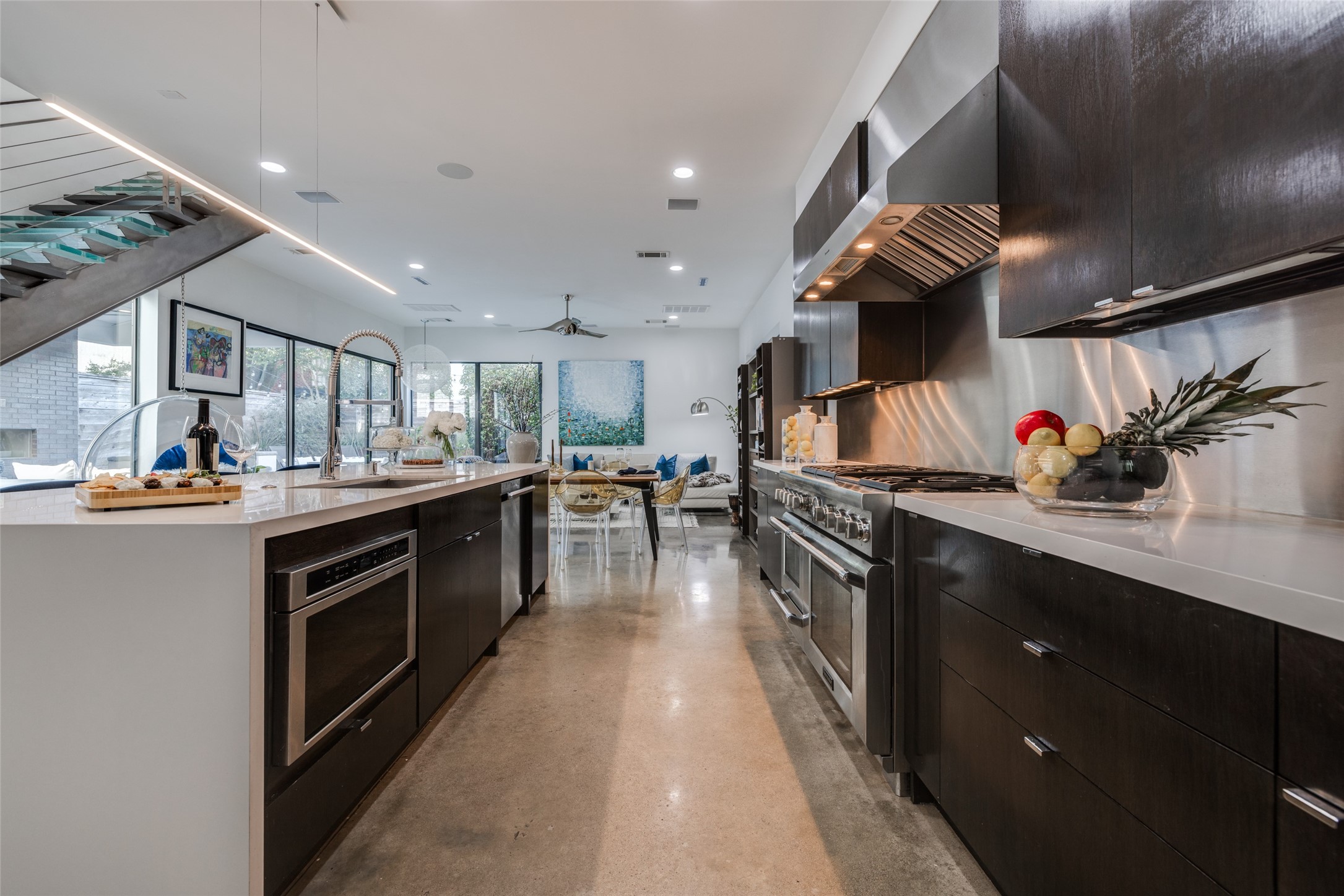 Gourmet Chef's Dream Kitchen with Thermador Professional Package - Range with 6 Burners, griddle, double oven, warming drawer, hood, SS backsplash, huge island with white quartz counter top with waterfall edge & SS sink with chrome Hansgrohe faucet, SS microwave & dishwasher