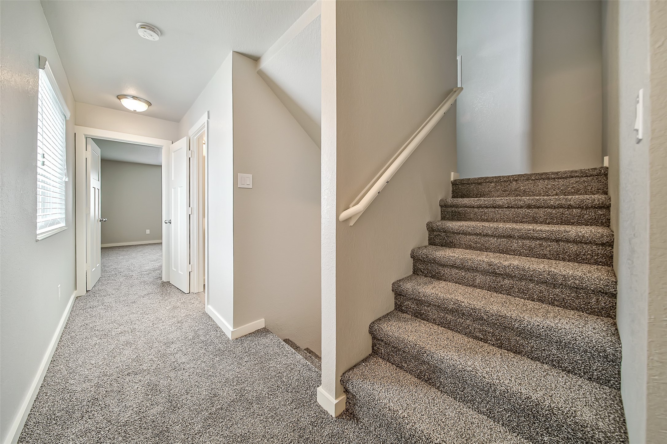 Second floor hallway and stairs leading up to third floor