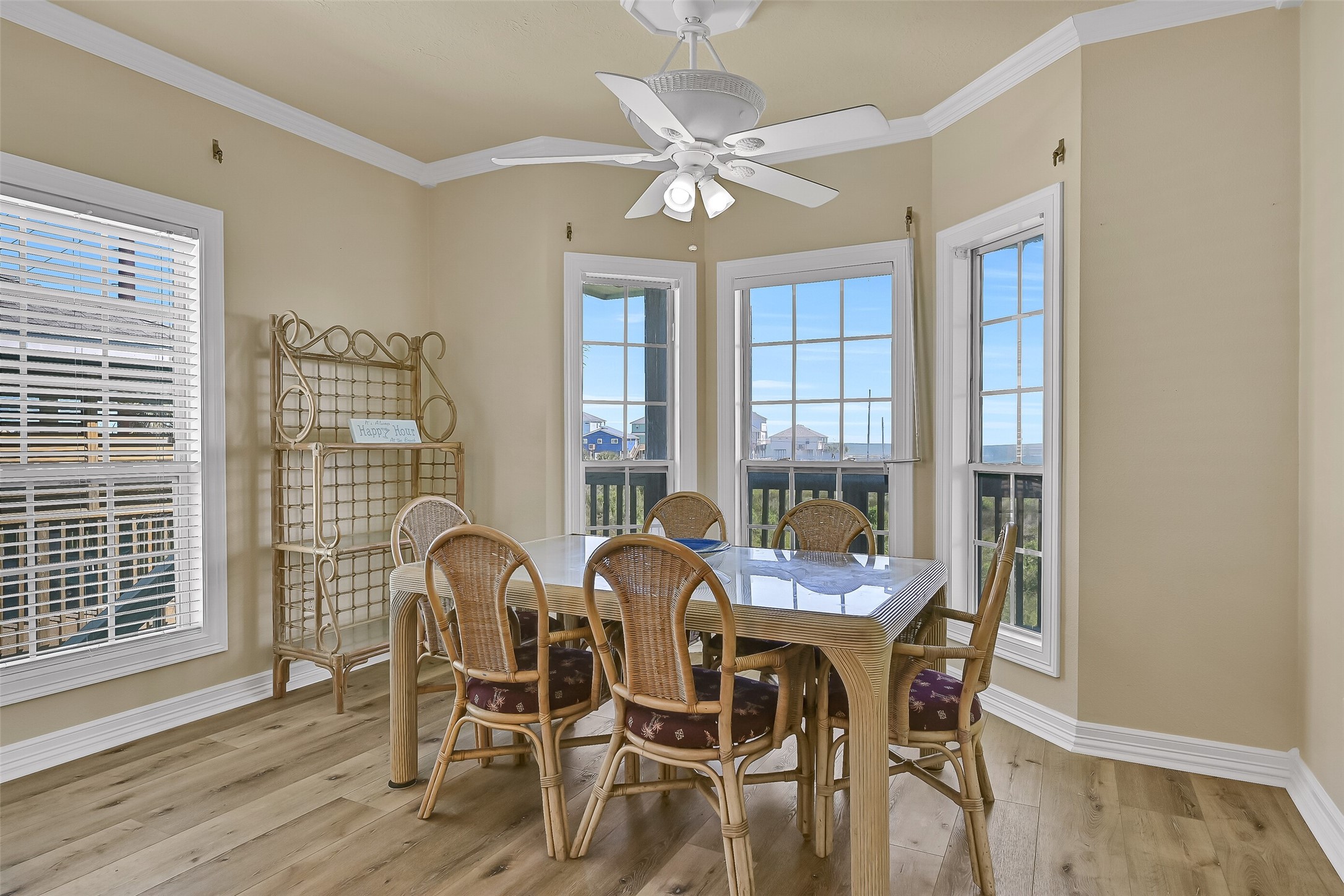 The dining room with walls of windows that brighten up the space. The table currently offers seating for 6.