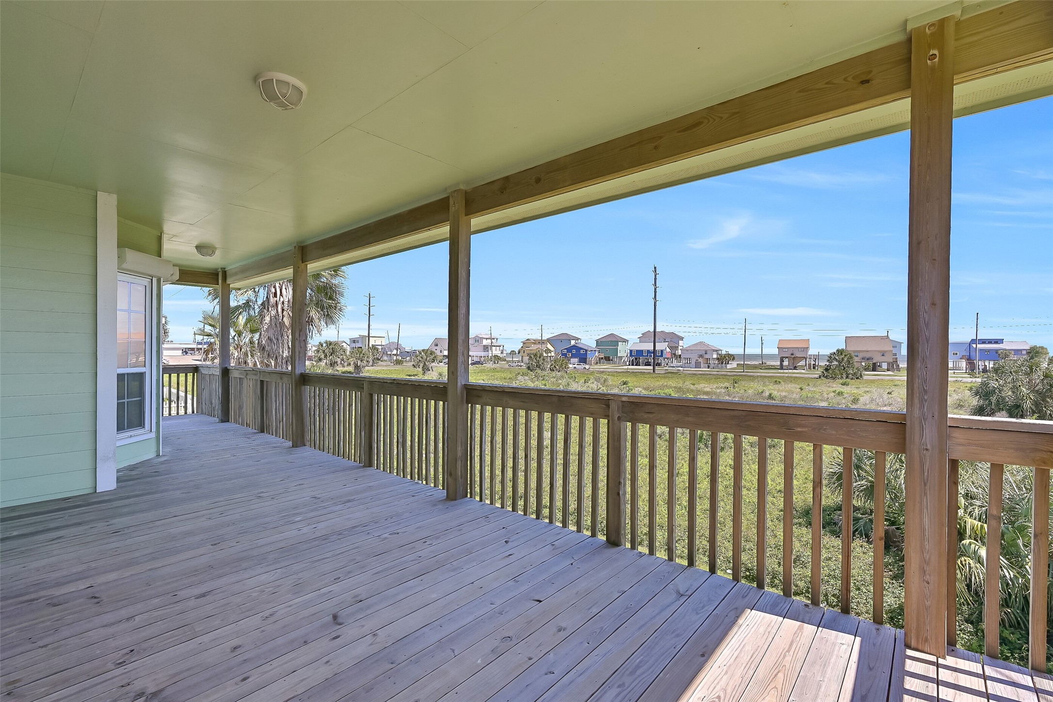 Upstairs the spacious covered deck offers beach and sunrise views and the perfect place to unwind.