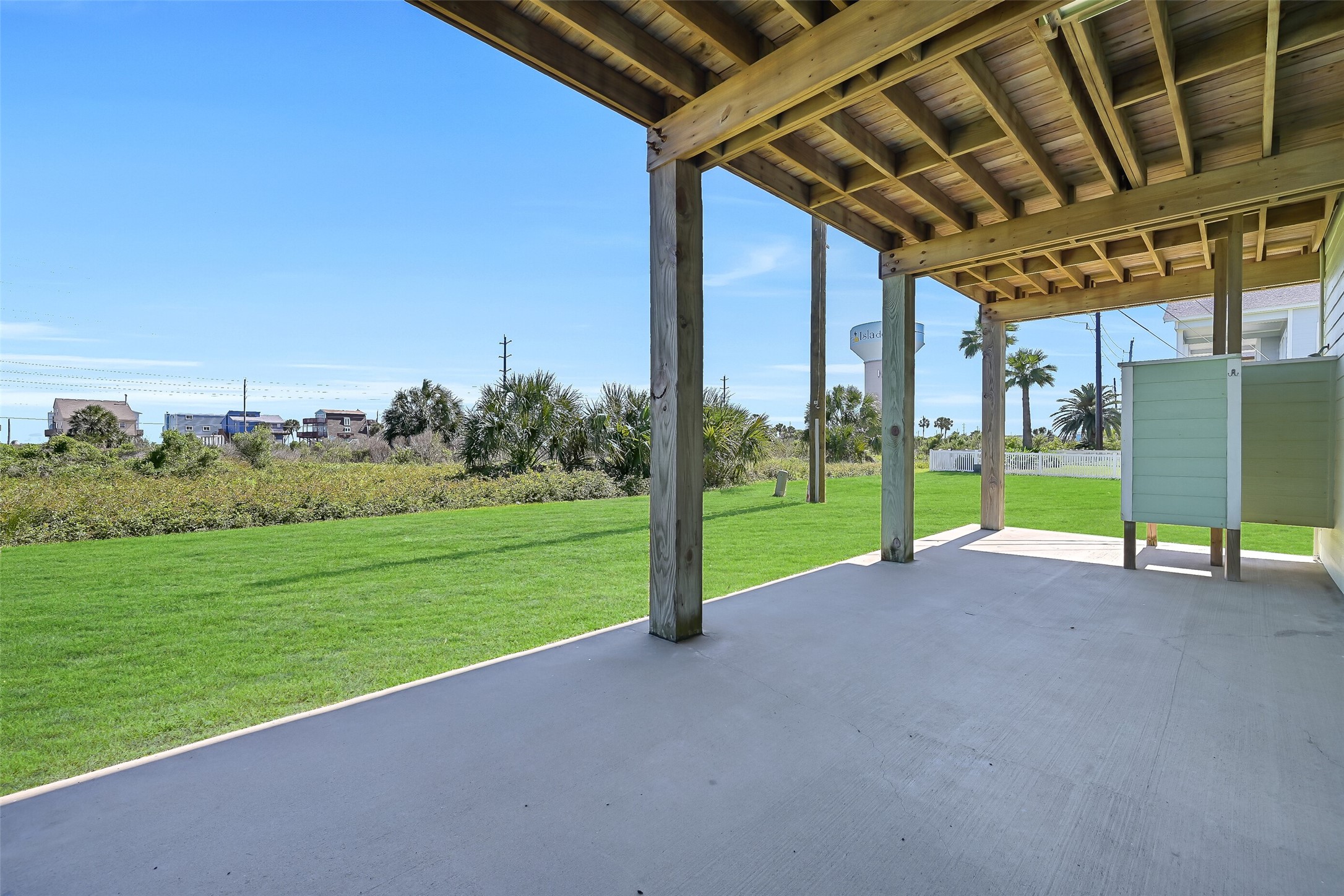 To the right is the outdoor shower. Perfect for rinsing off after the beach!