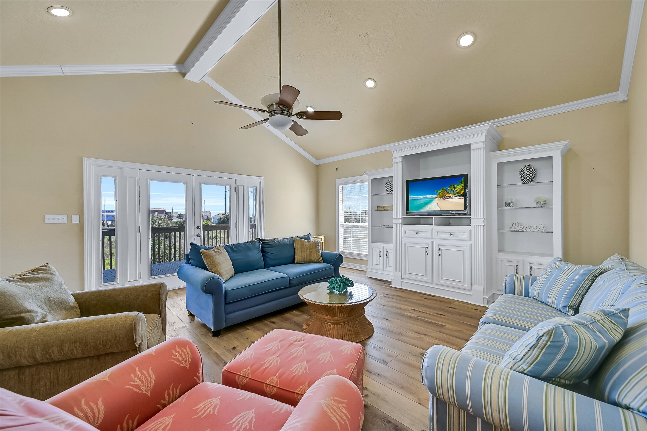 Notice the soaring ceilings and gorgeous wood  floors that flow throughout the space.