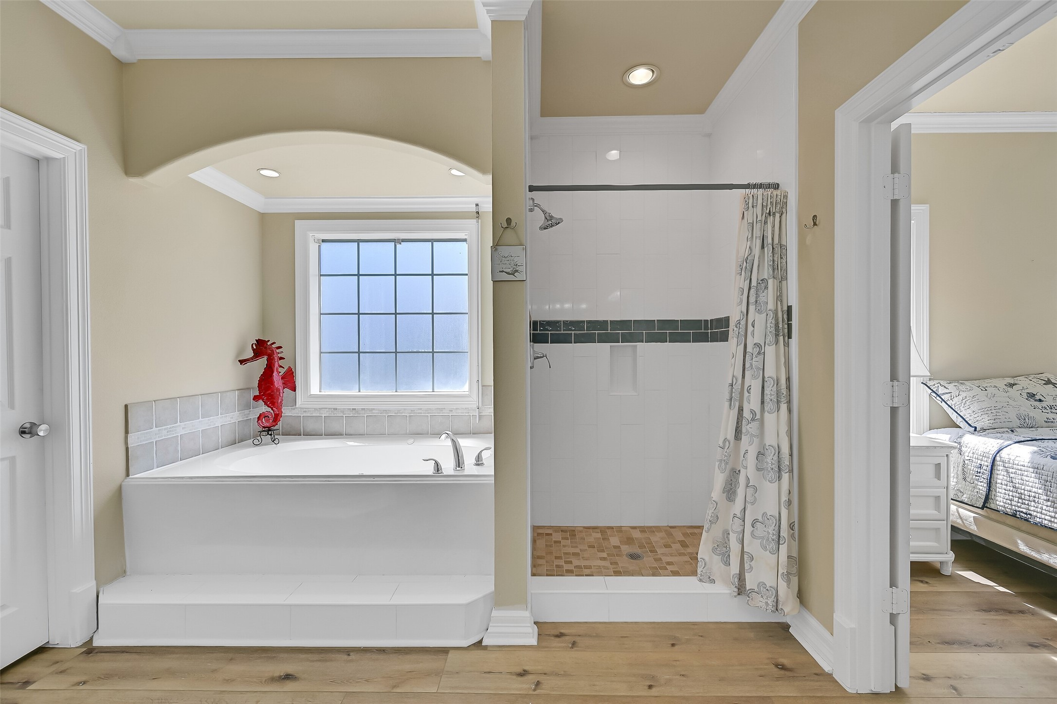 The bathroom is complete with a jetted tub, shower, toilet closet, and walk-in closet.