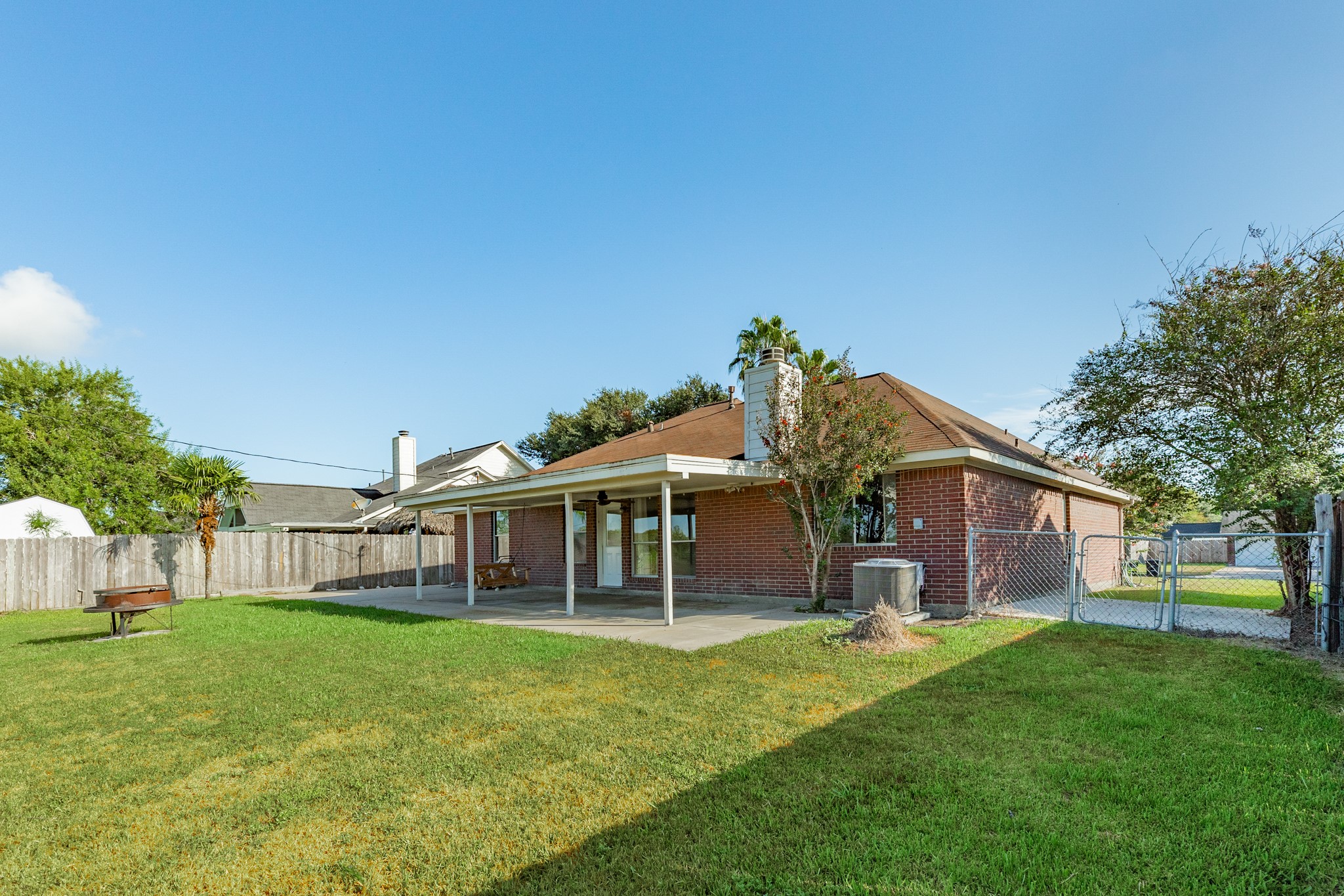 Spacious yard and large covered patio great for outdoor entertaining and relaxing.