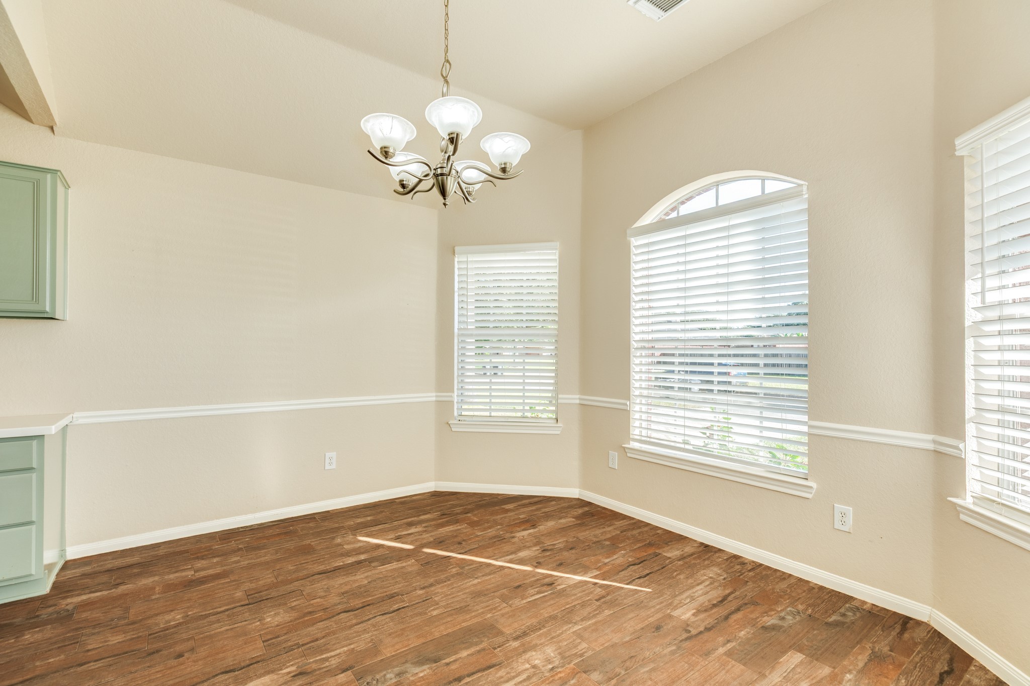 Dining area features multiple windows