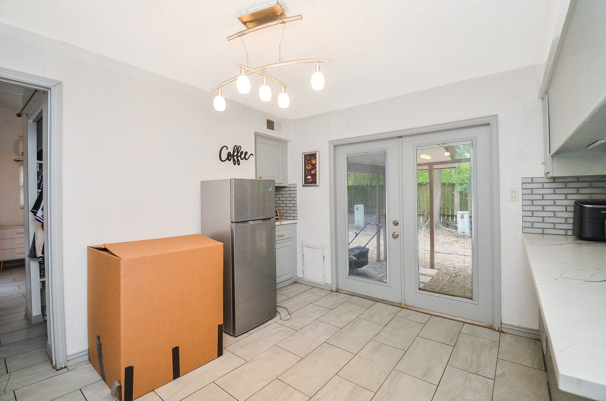 Here is a breakfast/formal dining area, paired with a coffee bar!
