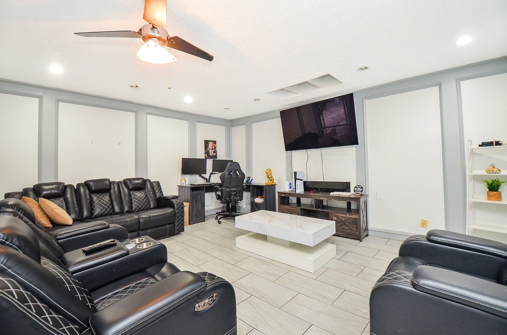Designed for gathering and relaxation, this oversized living room showcases contemporary finishes throughout.