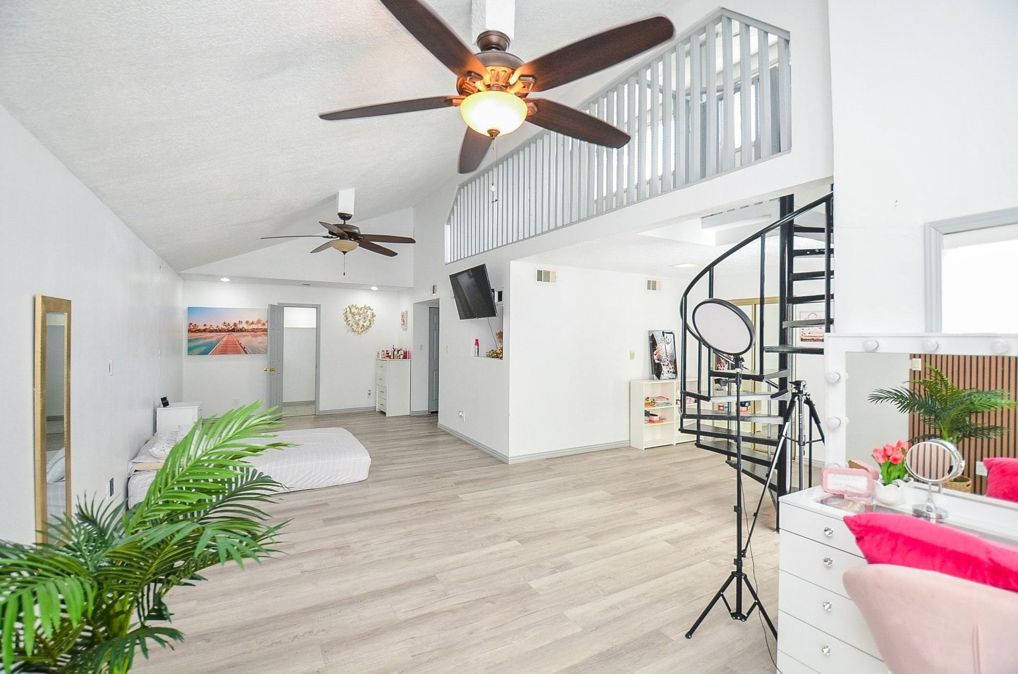 This room also has a loft feature, with a beautiful spiral staircase leading to a spacious upper level. Uniquely and well thought out floor plan.