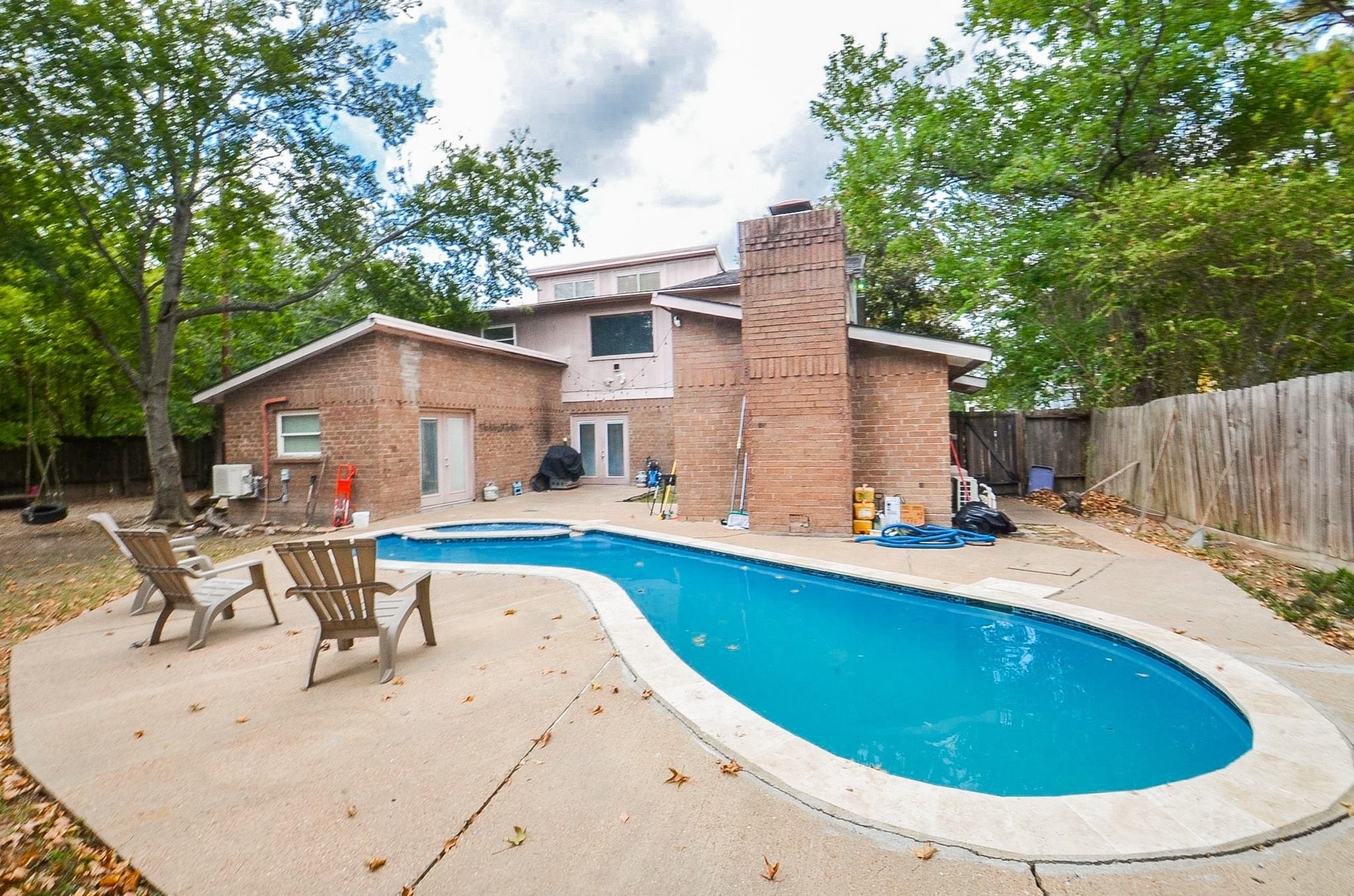 Welcome to this private backyard oasis: an in-ground pool recently replastered with new coping (per seller), an expansive concrete patio for lounging, and mature shade trees.