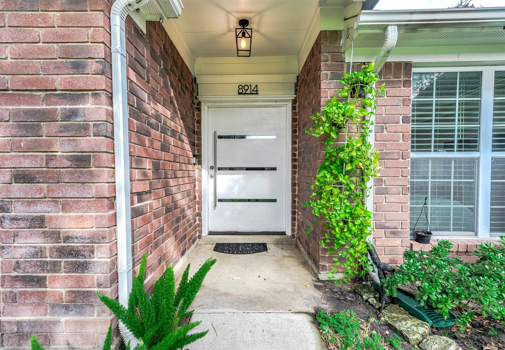 Approaching the front door you will
see the beautiful brick elevation,
covered front porch, and lovely
landscaping! Approaching the front door you will
see the beautiful brick elevation,
covered front porch, and lovely
landscaping!