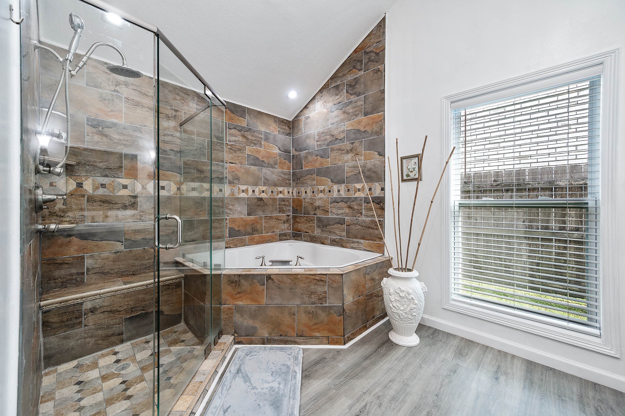 The walk-in shower features tile
surround and the separate tub is
great for soaking after a long day!