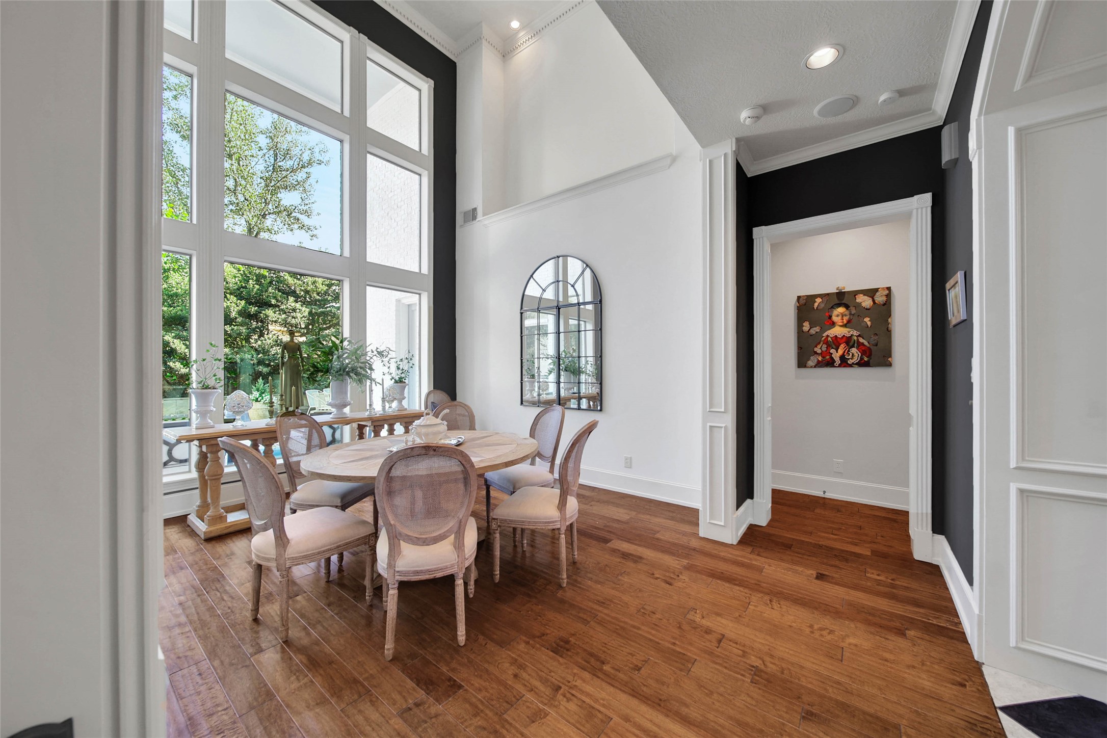 Natural light enters through the floor to ceiling windows.