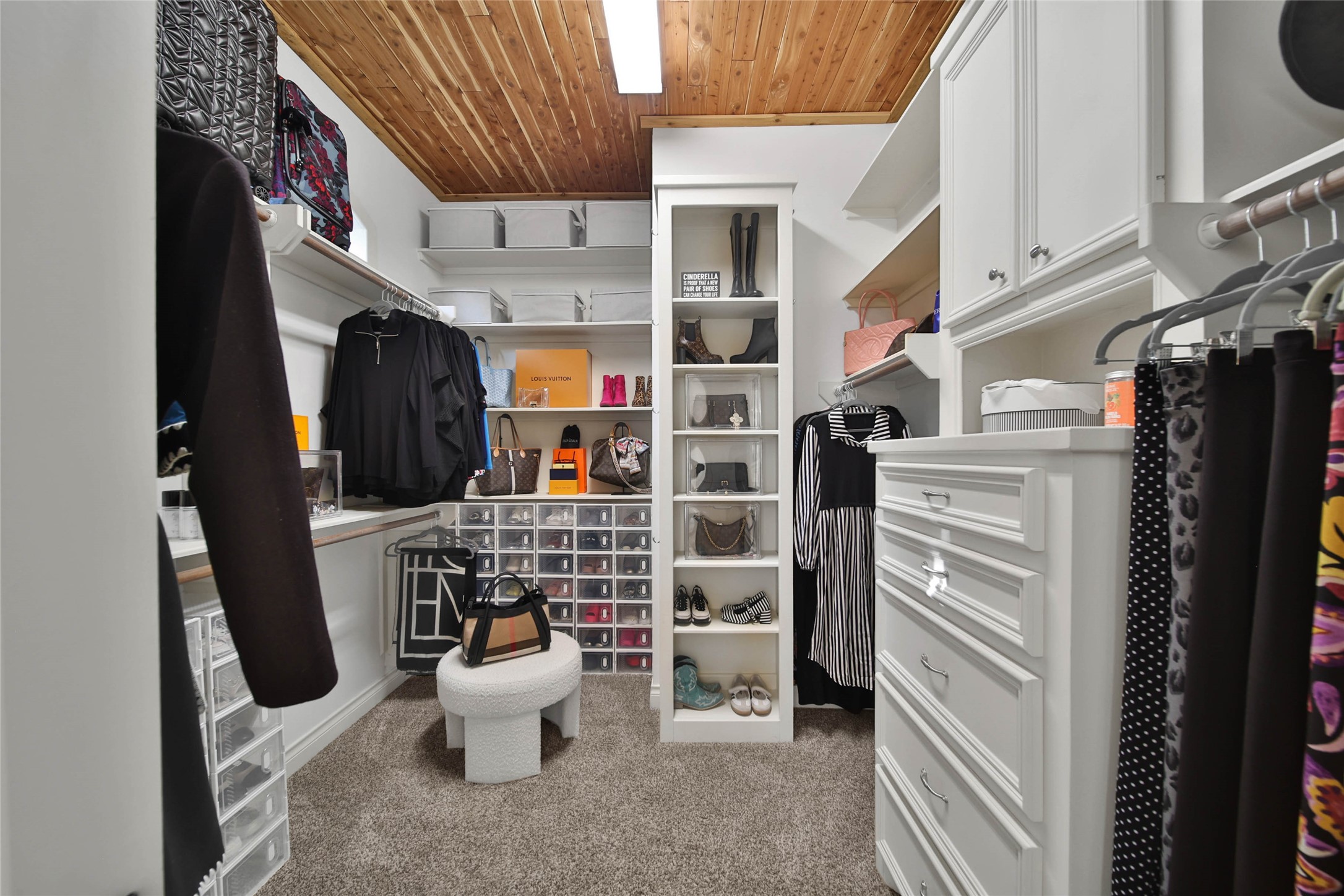 Spacious and organized, the closet boasts built-ins, ample drawers, and generous hanging space.