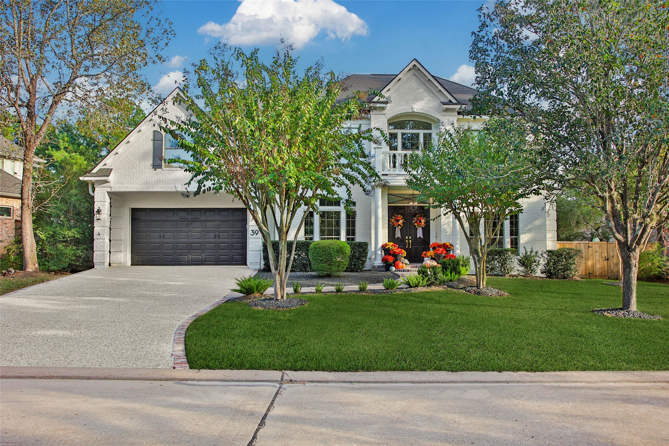 Discover timeless elegance at 39 W Old Sterling, where classic architecture meets lush landscaping, creating an inviting sanctuary in a serene neighborhood.