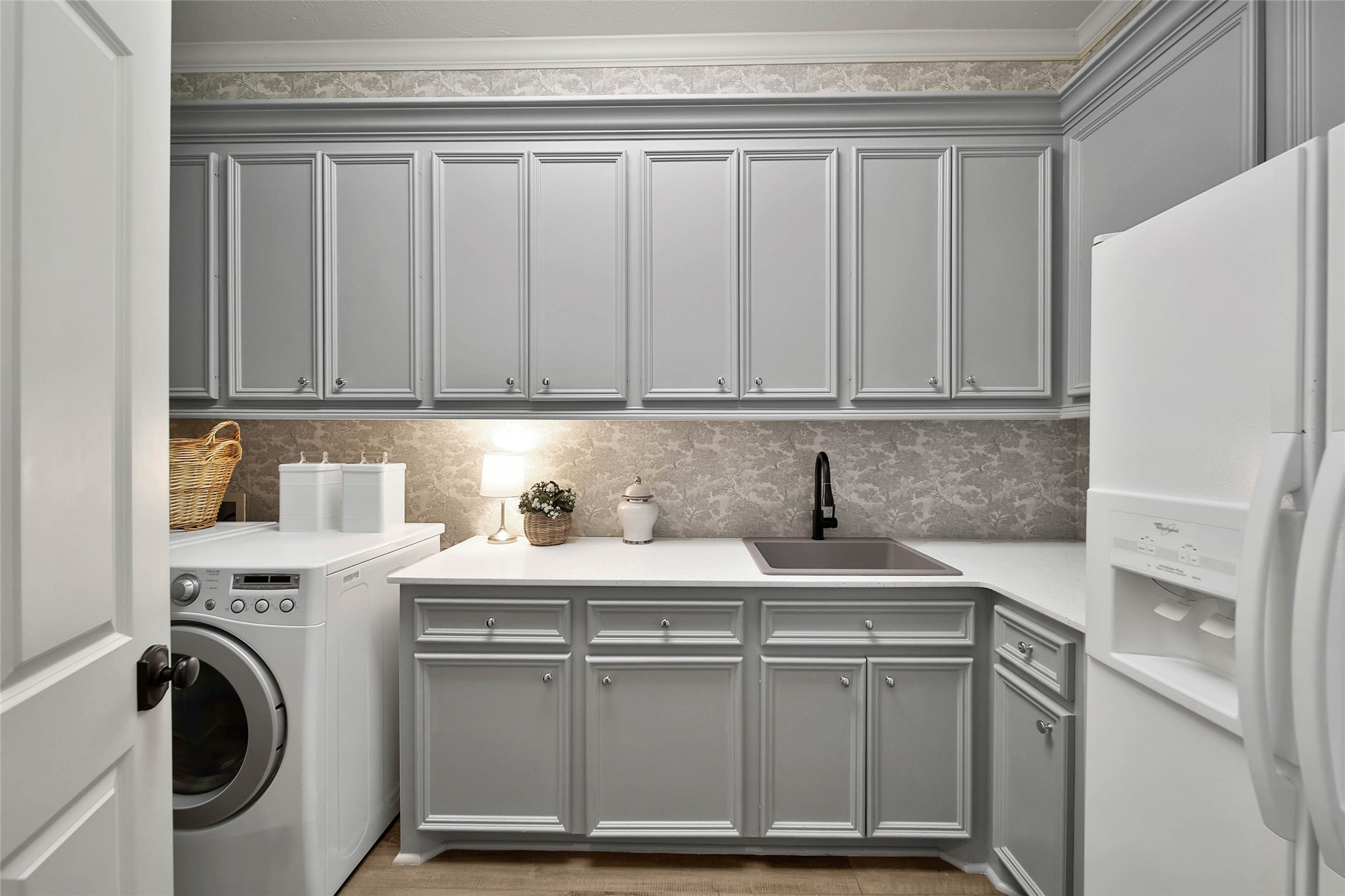 Large utility with built in cabinetry.
