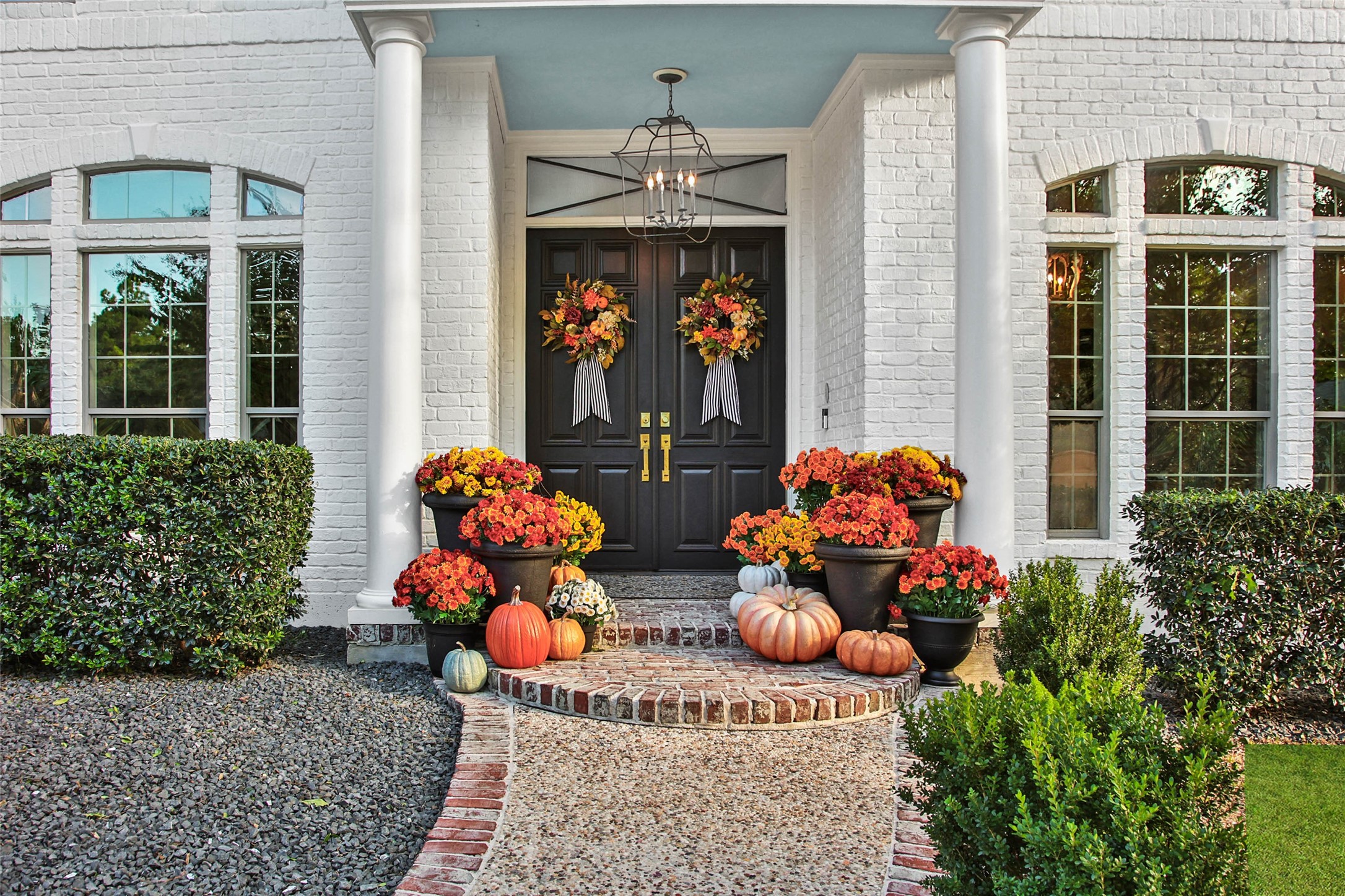 Grand double door entry welcomes you to this charming Southern-style custom home.
