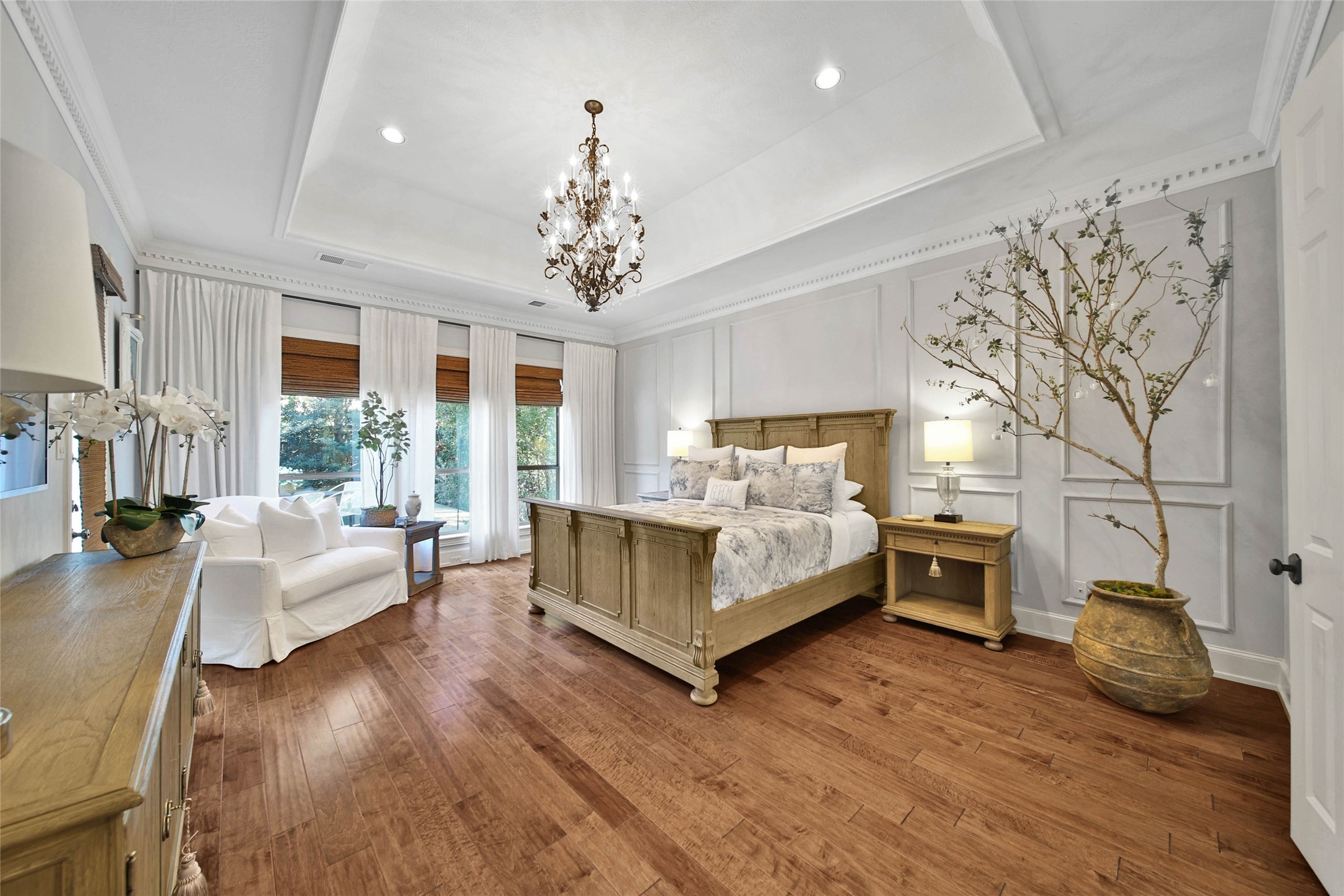 The primary bedroom boasts an elegant tray ceiling, adding a touch of sophistication.