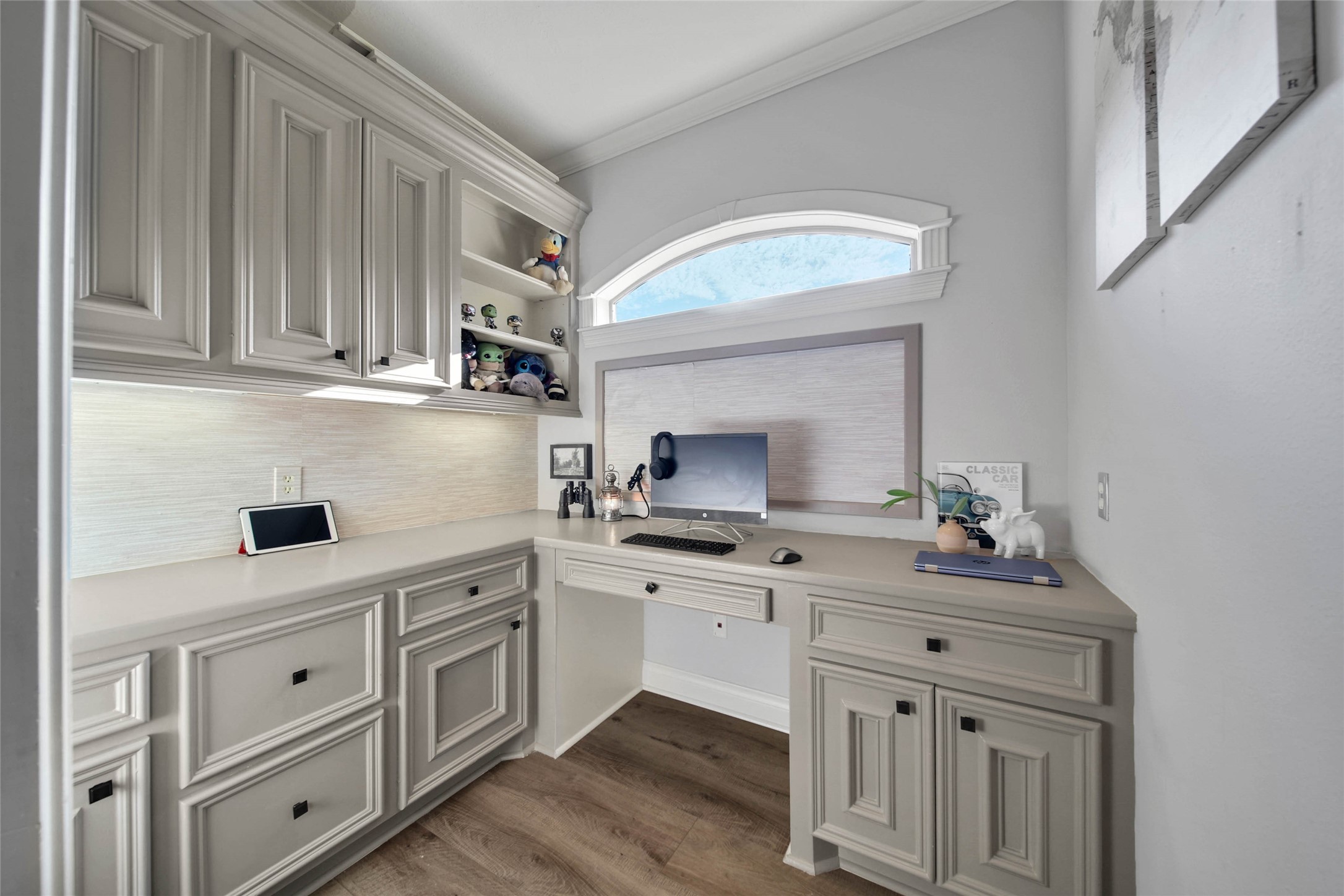 Upstairs study room with built-in cabinetry and abundant natural light.