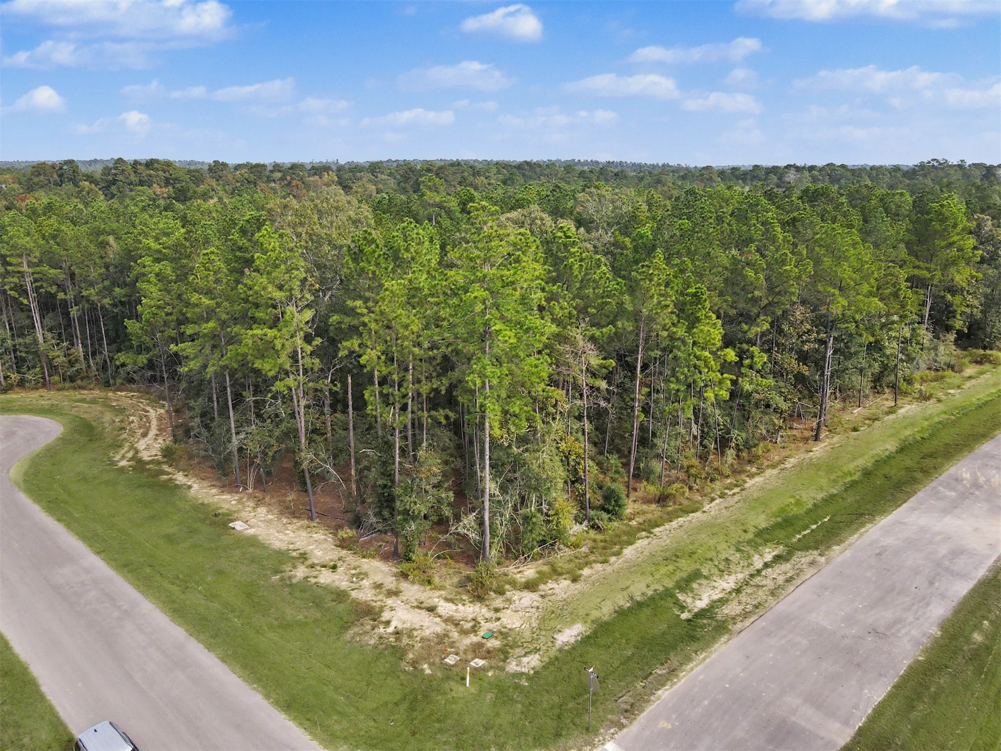 1-acre corner lot in High Meadow West where you can build on your own timeline and bring your own builder with ACC approval.