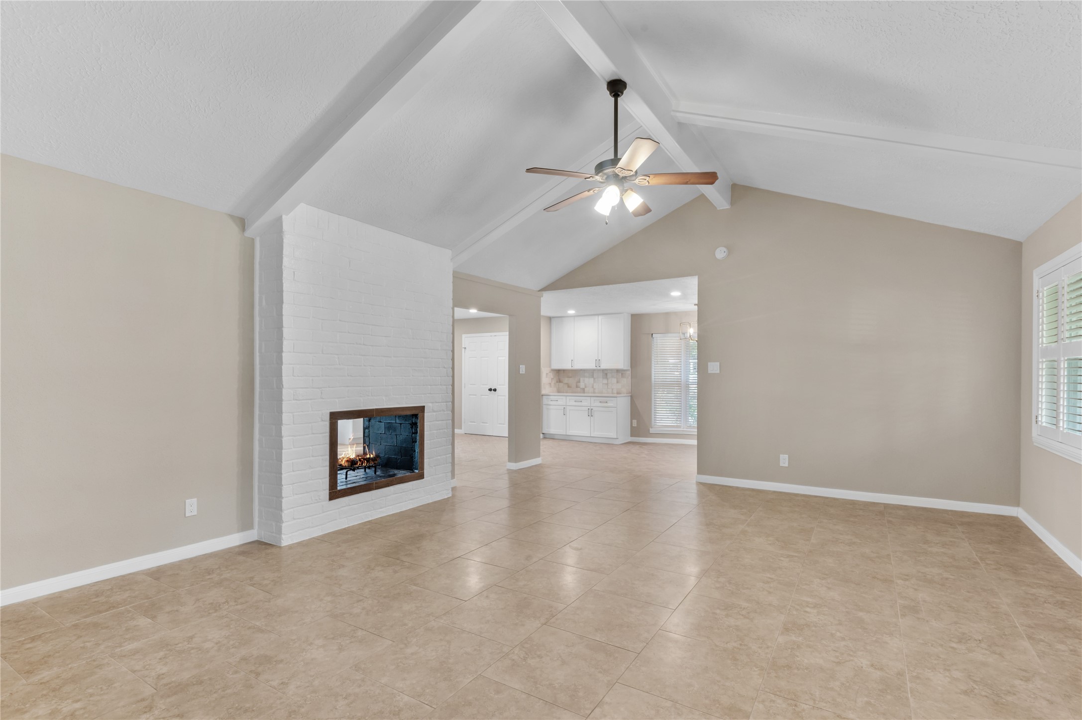 Large first living room looking toward dining Large first living room looking toward dining