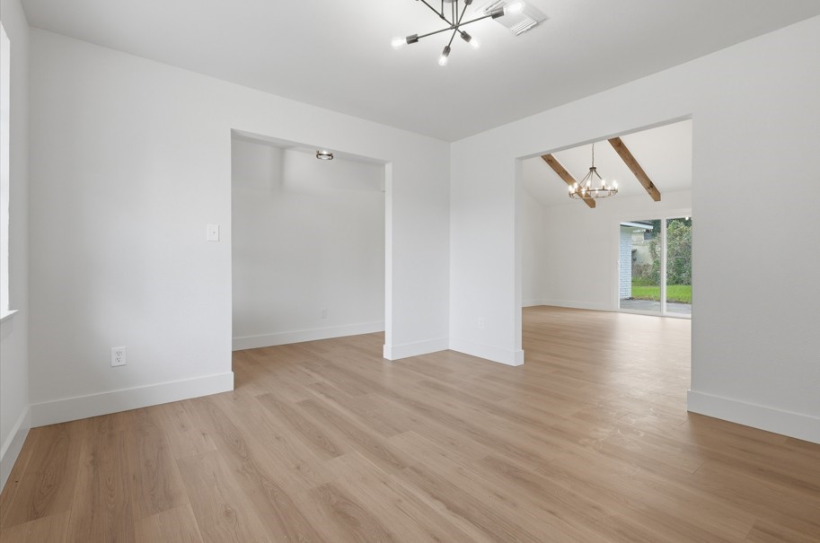 The dining space is thoughtfully separated from the living room, creating an intimate setting where families can gather and enjoy peaceful meals together. This dedicated area provides the perfect atmosphere for meaningful conversations, shared dinners, and memorable moments.