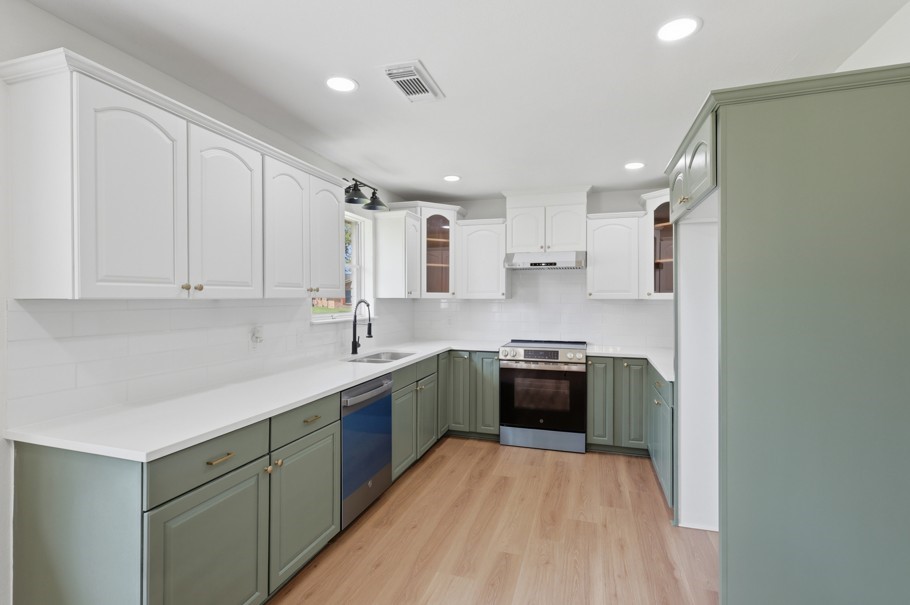 The kitchen features timeless charm with beautifully restored original cabinetry, thoughtfully updated to ensure lasting appeal and functionality. New appliances, abundant natural light, and classic details create a warm and inviting space perfect for everyday living and entertaining. The kitchen features timeless charm with beautifully restored original cabinetry, thoughtfully updated to ensure lasting appeal and functionality. New appliances, abundant natural light, and classic details create a warm and inviting space perfect for everyday living and entertaining.