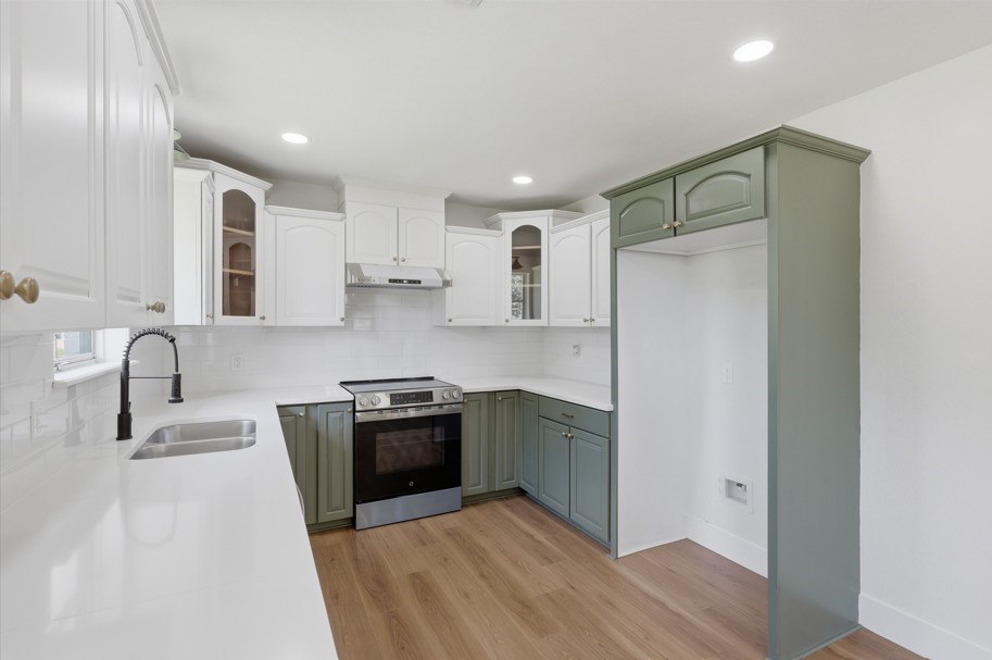 The kitchen features timeless charm with beautifully restored original cabinetry, thoughtfully updated to ensure lasting appeal and functionality. New appliances, abundant natural light, and classic details create a warm and inviting space perfect for everyday living and entertaining.