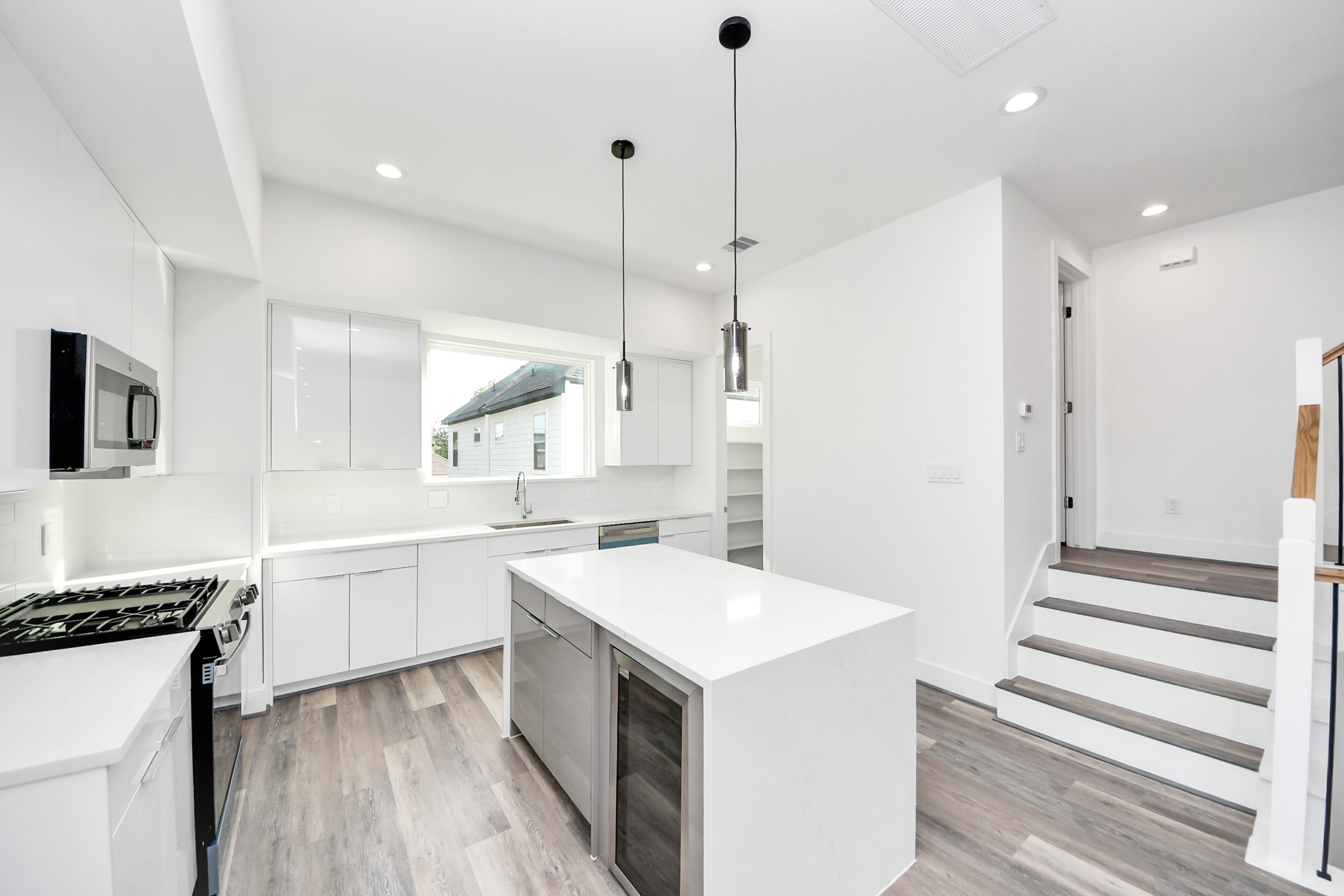Kitchen with island and beverage cooler (Sample photo from same floor plan next to the address)
