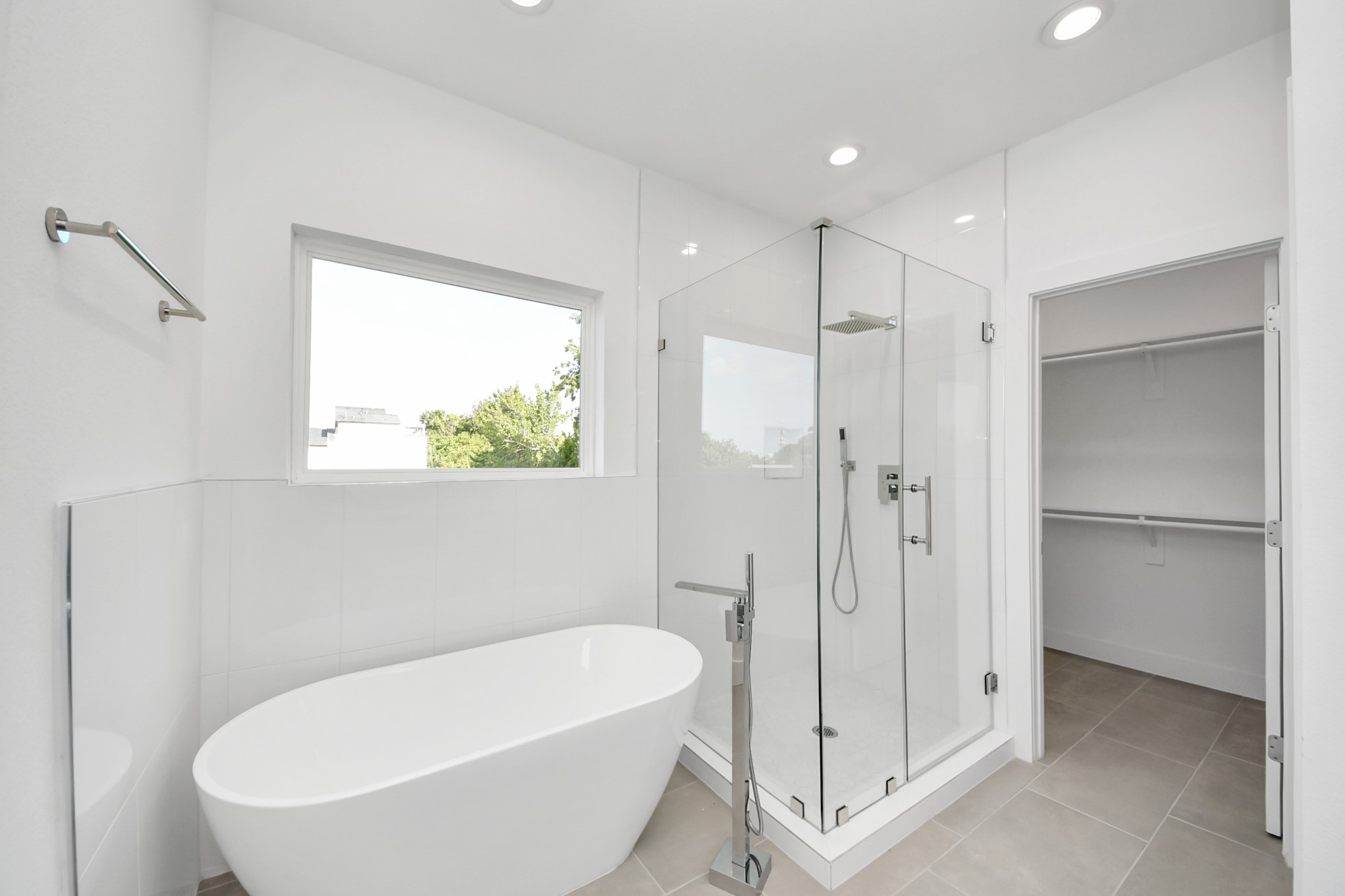 Primary bathroom with shower and tub (Sample photo from same floor plan next to the address)