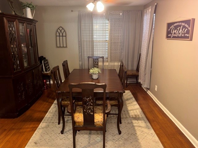 The dining room is next to the kitchen. Nice hardwood floors in the dining room. The window looks out onto the front yard.