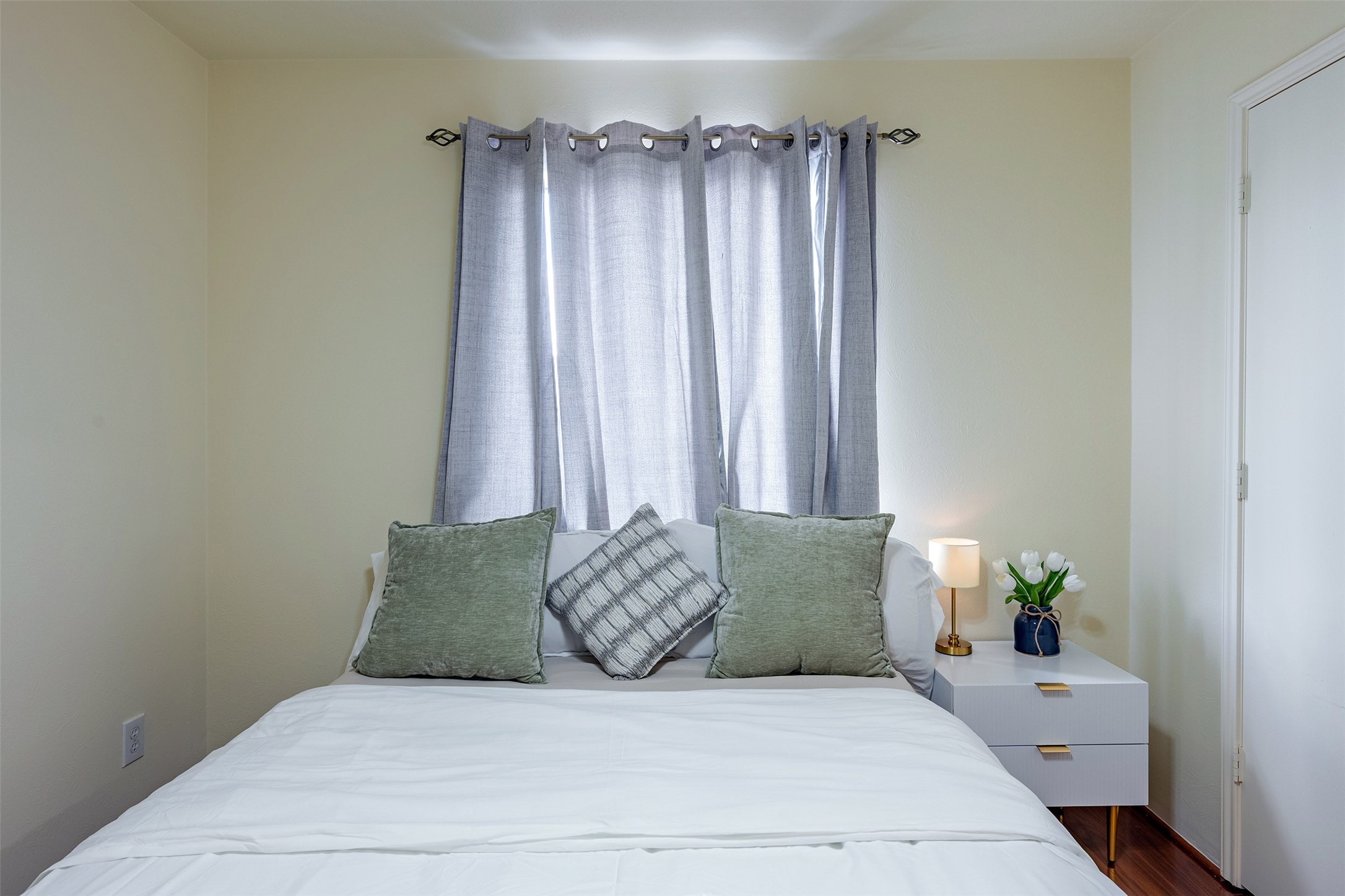 Bedroom 3: Comfortable secondary bedroom with great lighting and flexible use as a guest room or home office.