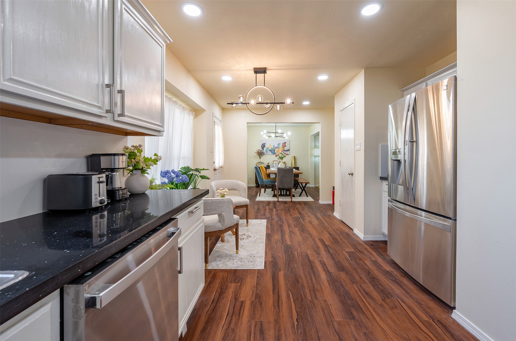 Kitchen: Modern, fully-equipped kitchen with ample cabinet space, premium countertops, and a functional layout.