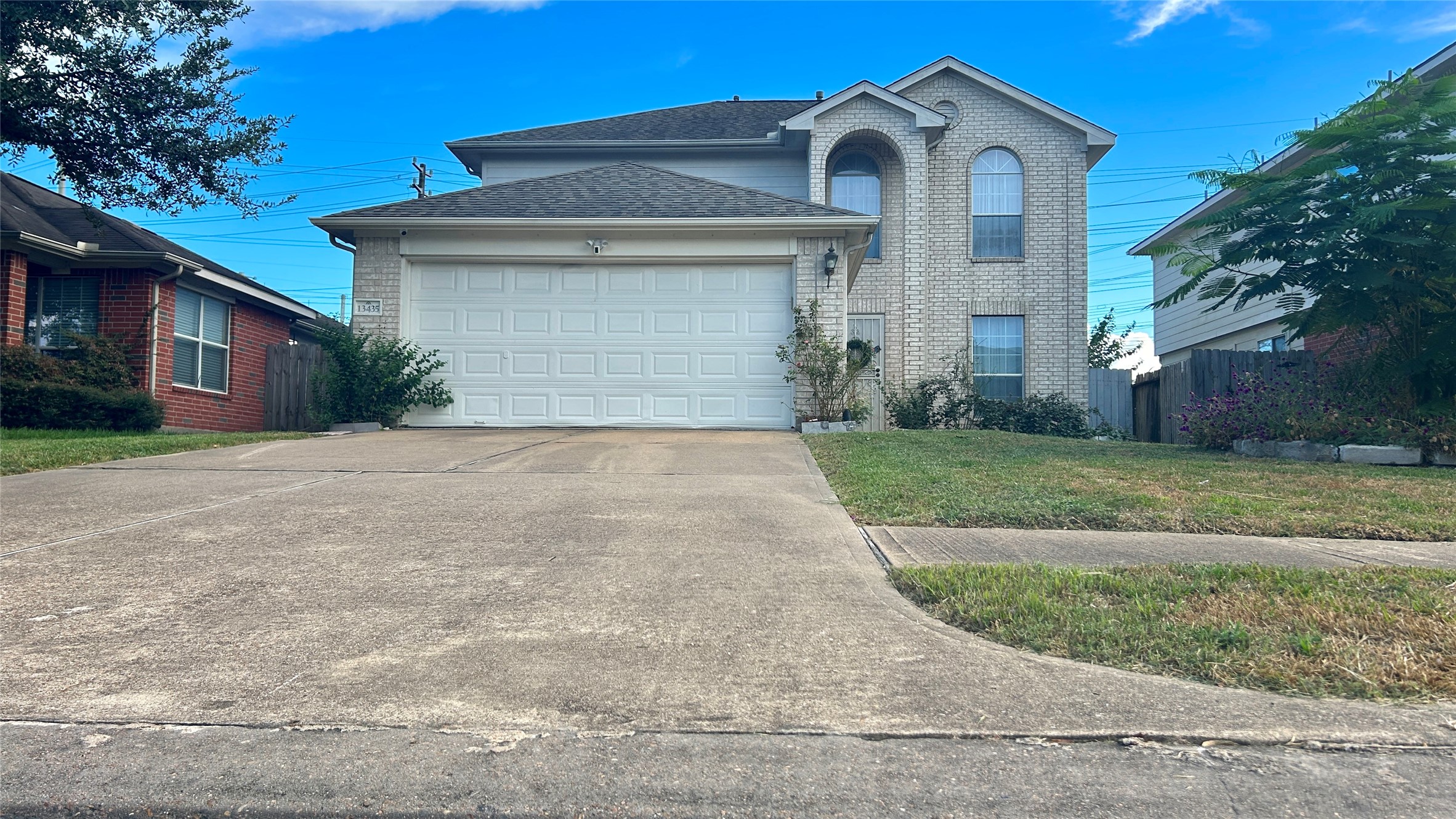 Stunning front exterior with exceptional curb appeal and well-maintained landscaping