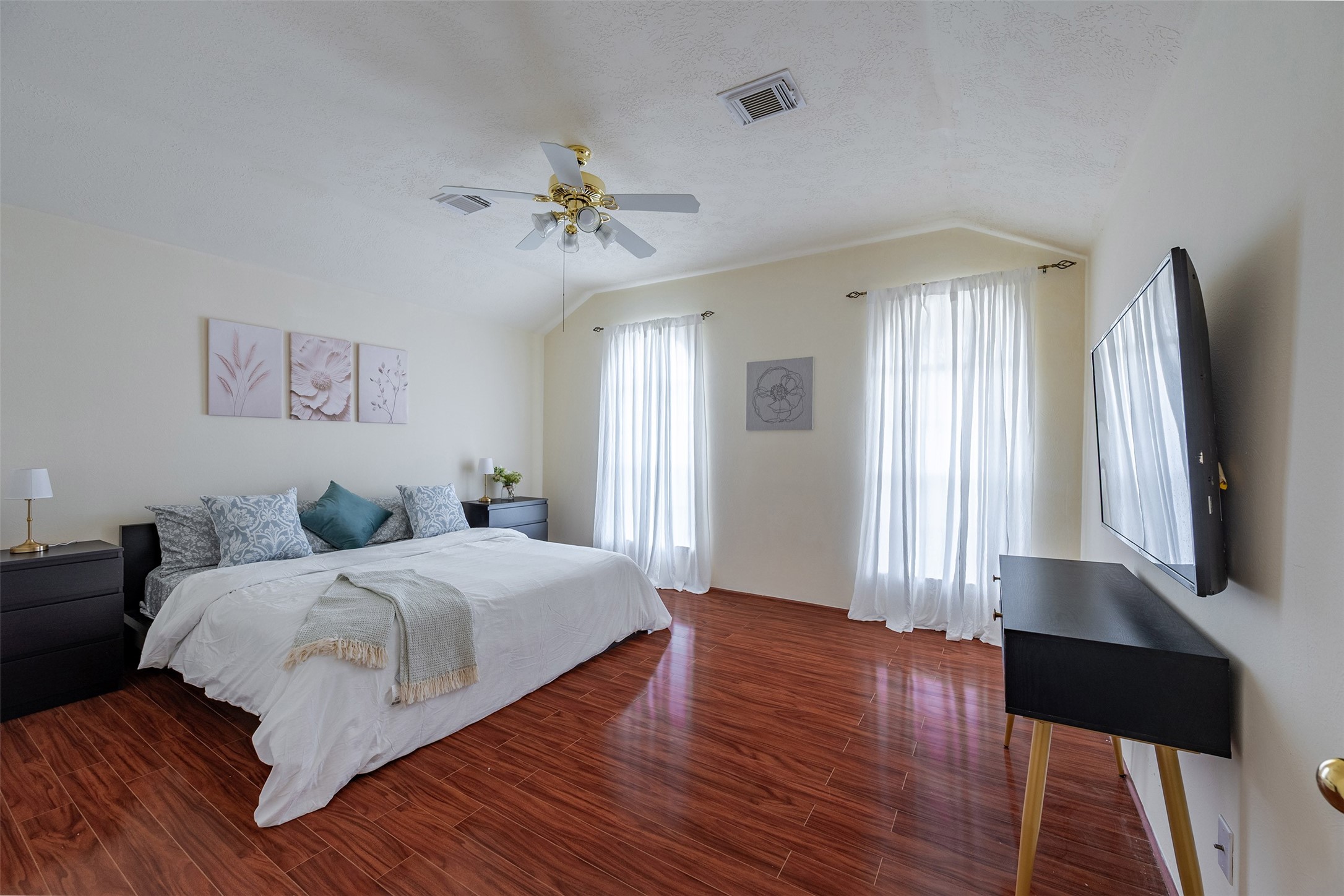Primary Bedroom: Generously sized primary suite offering a peaceful retreat with great natural light.
