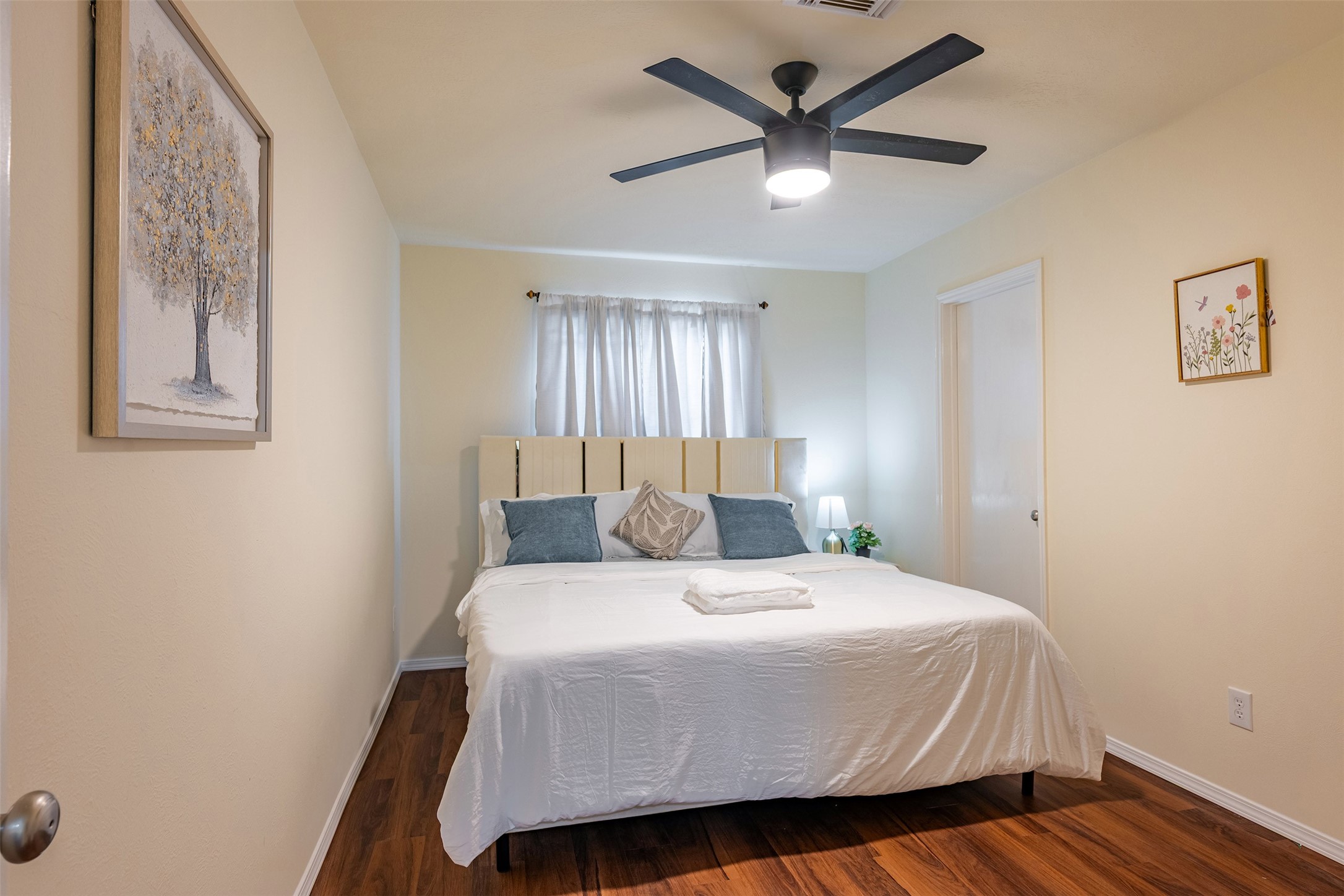 Bedroom 4: Comfortable secondary bedroom with great lighting and flexible use as a guest room or home office.