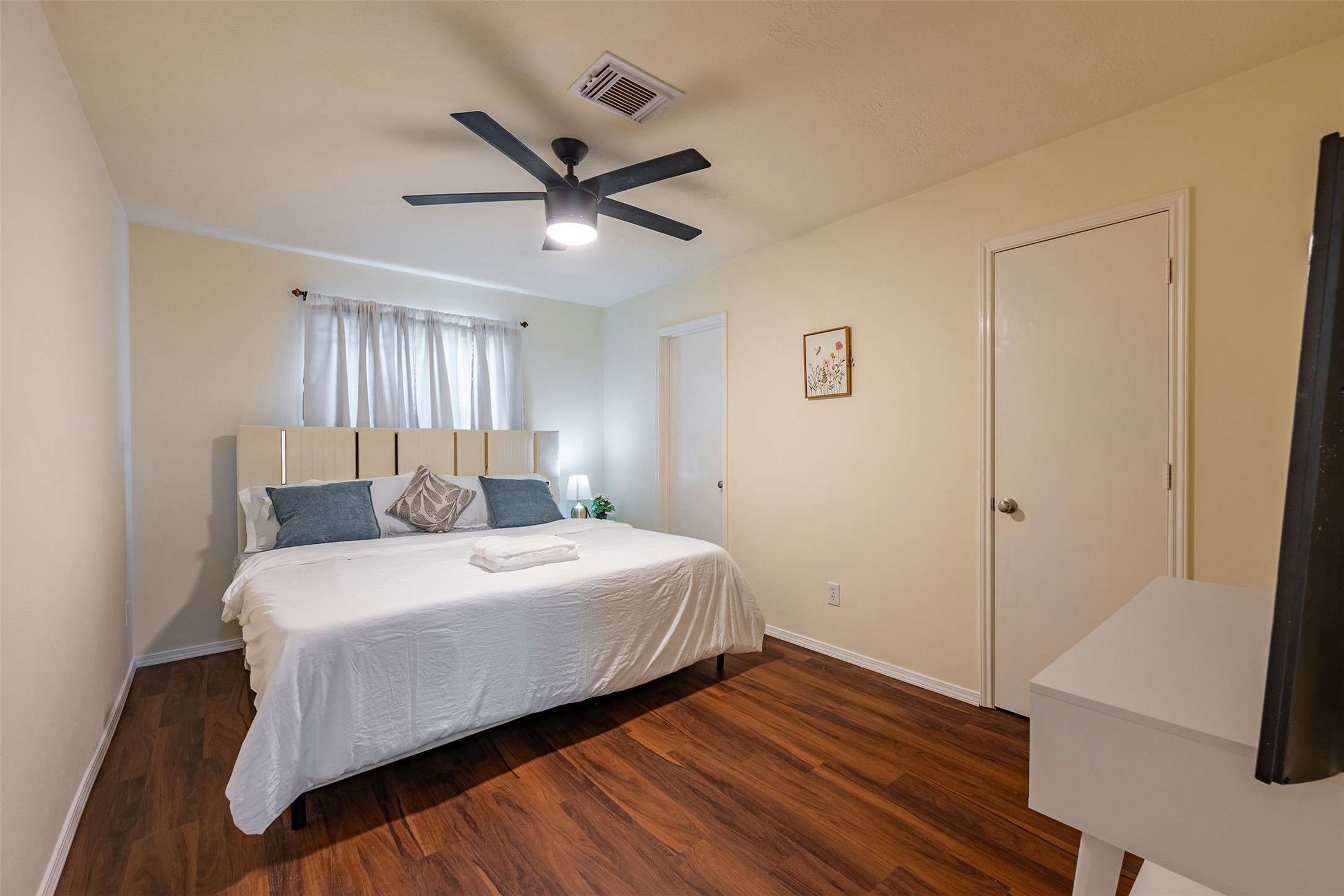 Bedroom 4: Comfortable secondary bedroom with great lighting and flexible use as a guest room or home office.