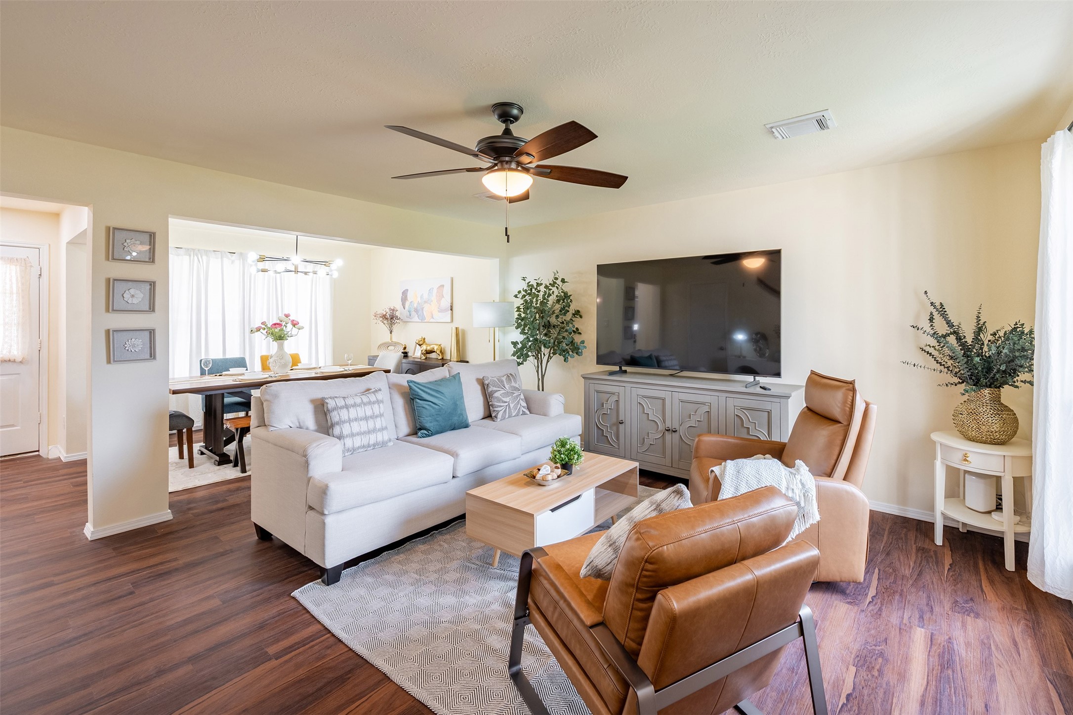 Living Room
: Spacious and bright living room featuring abundant natural light and an open-concept feel.
