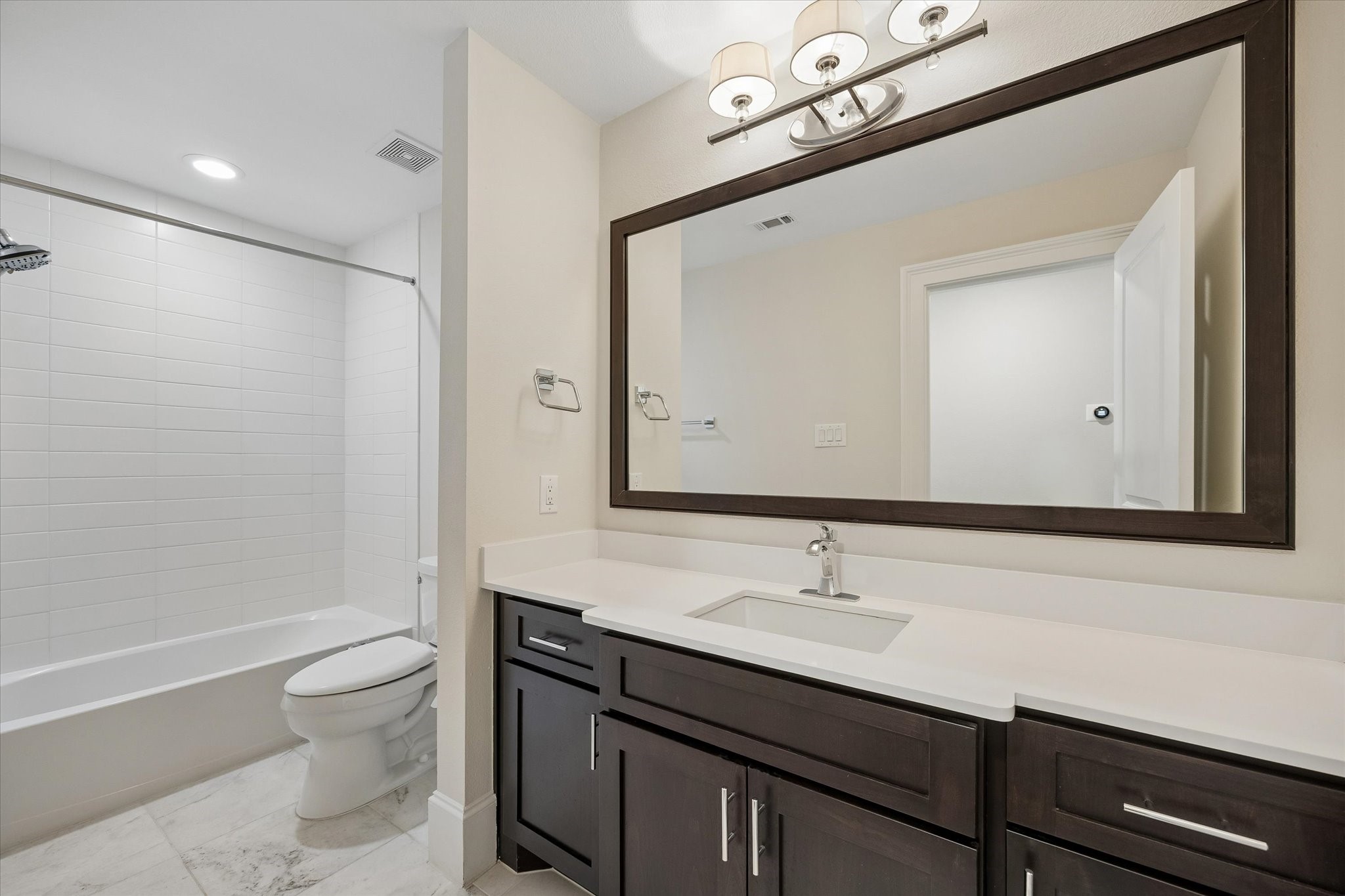 Full bathroom with a shower/tub combo located on the 3rd floor.