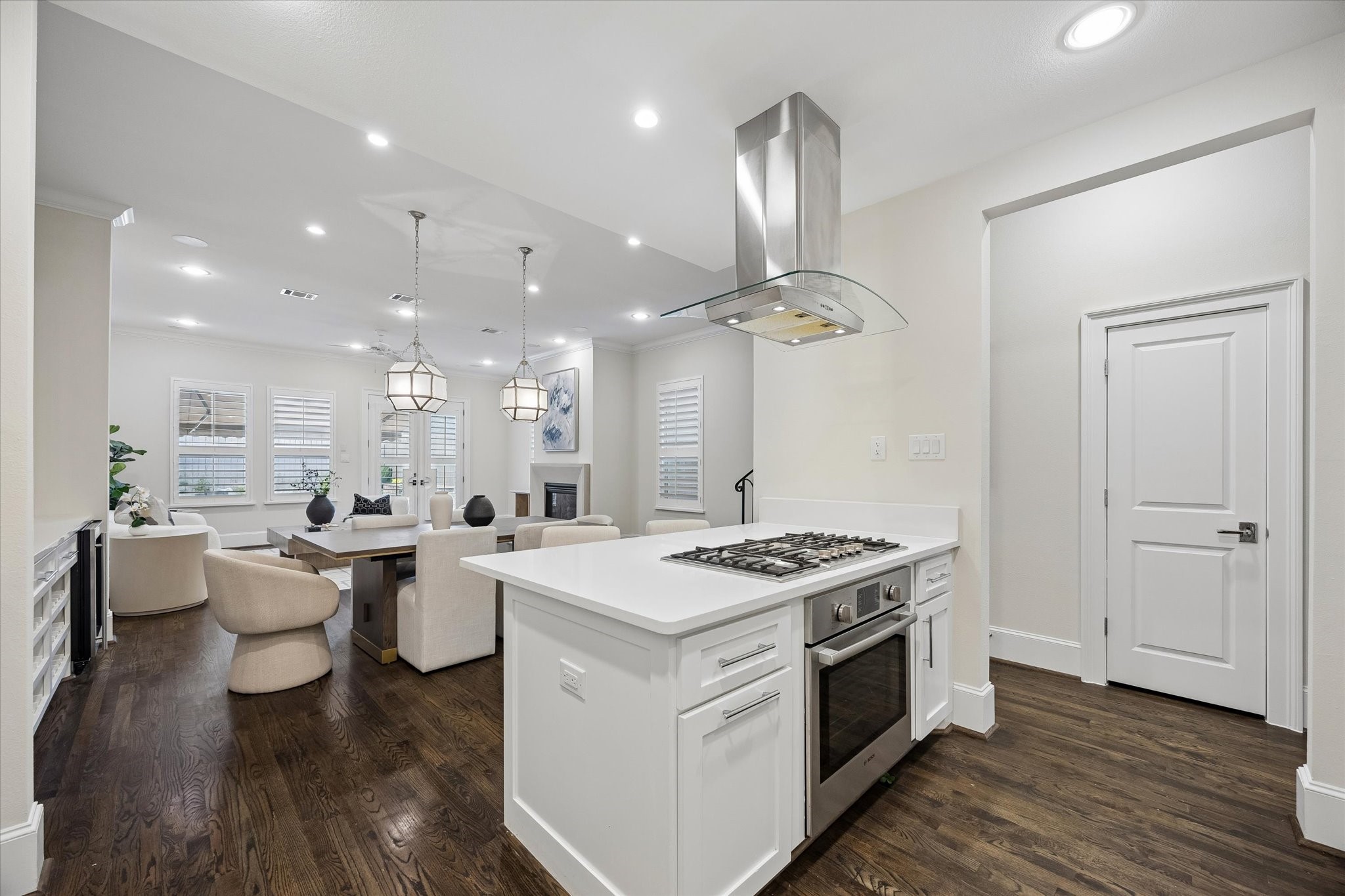 The open-concept kitchen flows effortlessly into the dining area and living room, making it perfect for entertaining and everyday living.