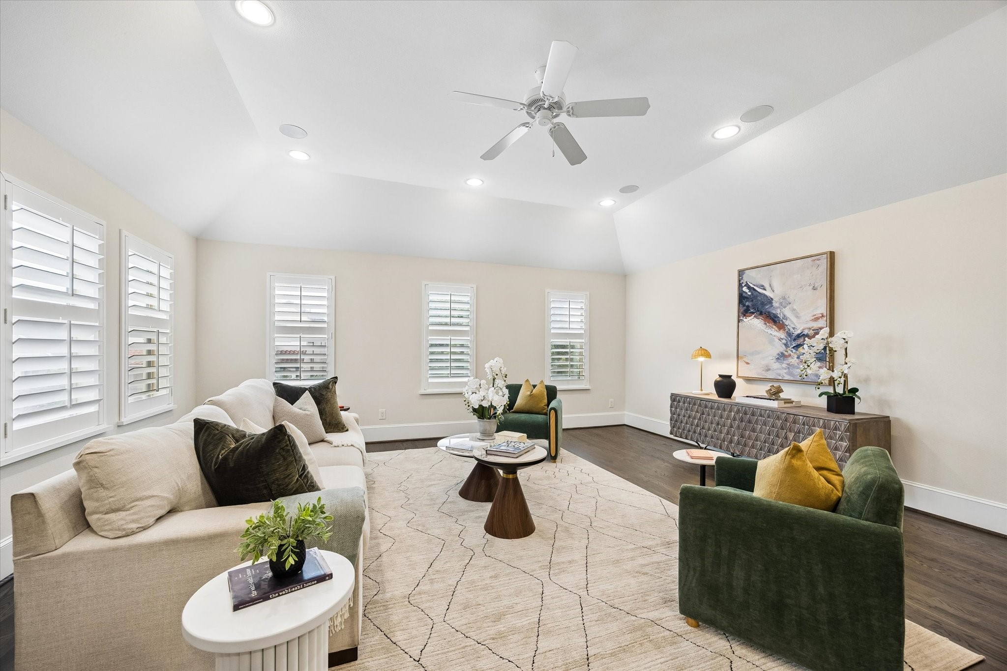 Two walls of windows flood the room with natural light.