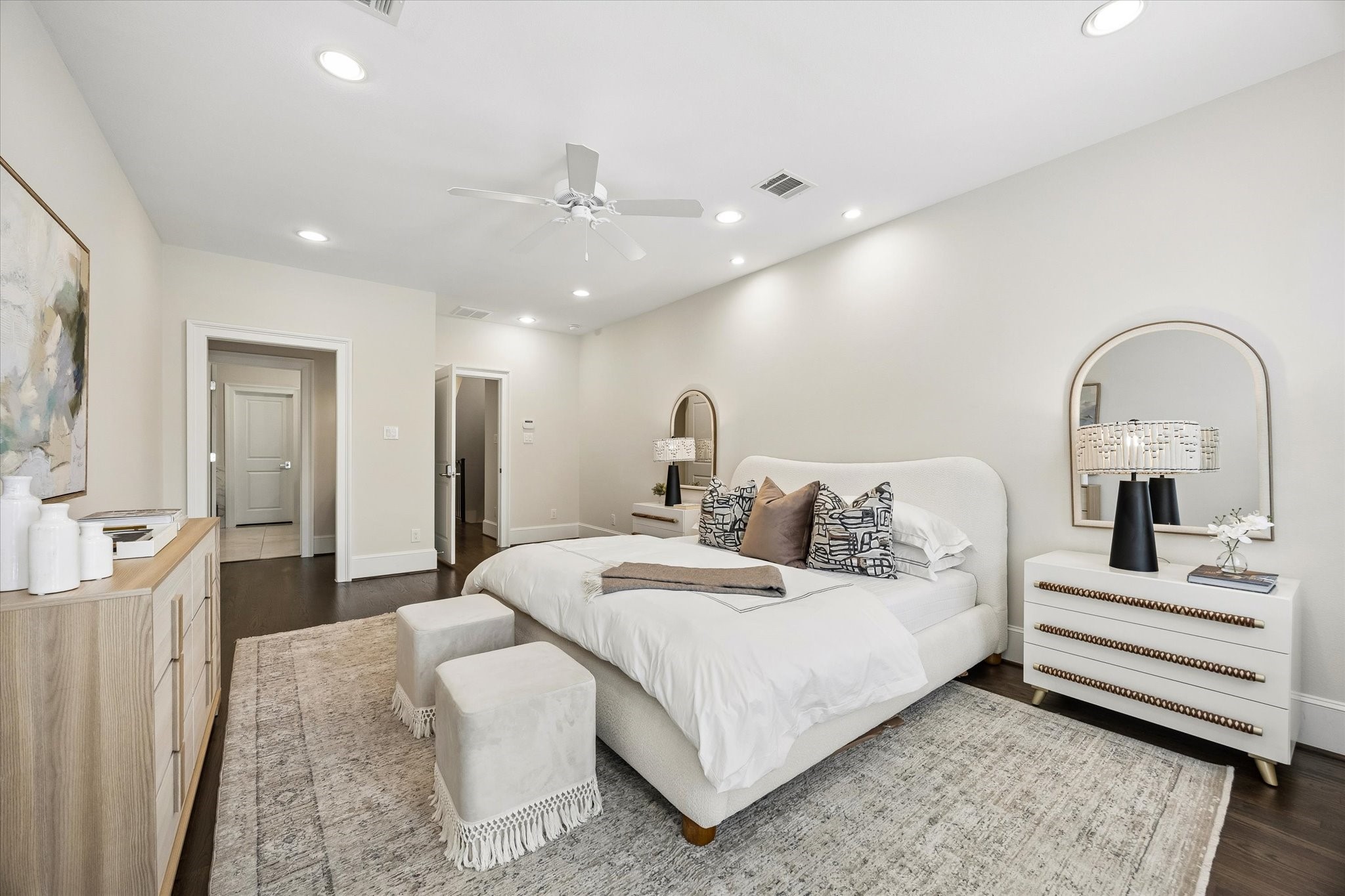The expansive primary suite easily accommodates large furniture.