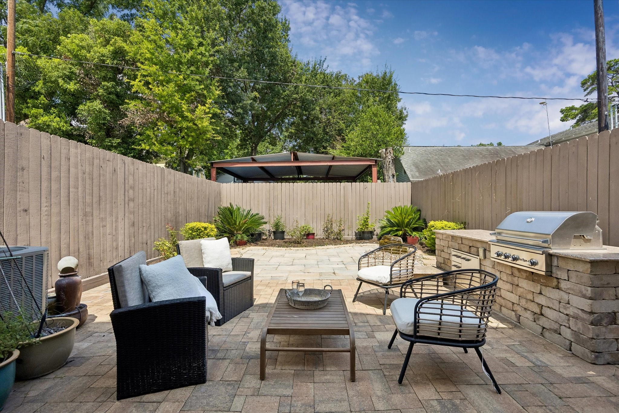 Designed for both entertaining and relaxation, the backyard offers the perfect setting to gather with friends and loved ones or unwind in your private outdoor oasis.