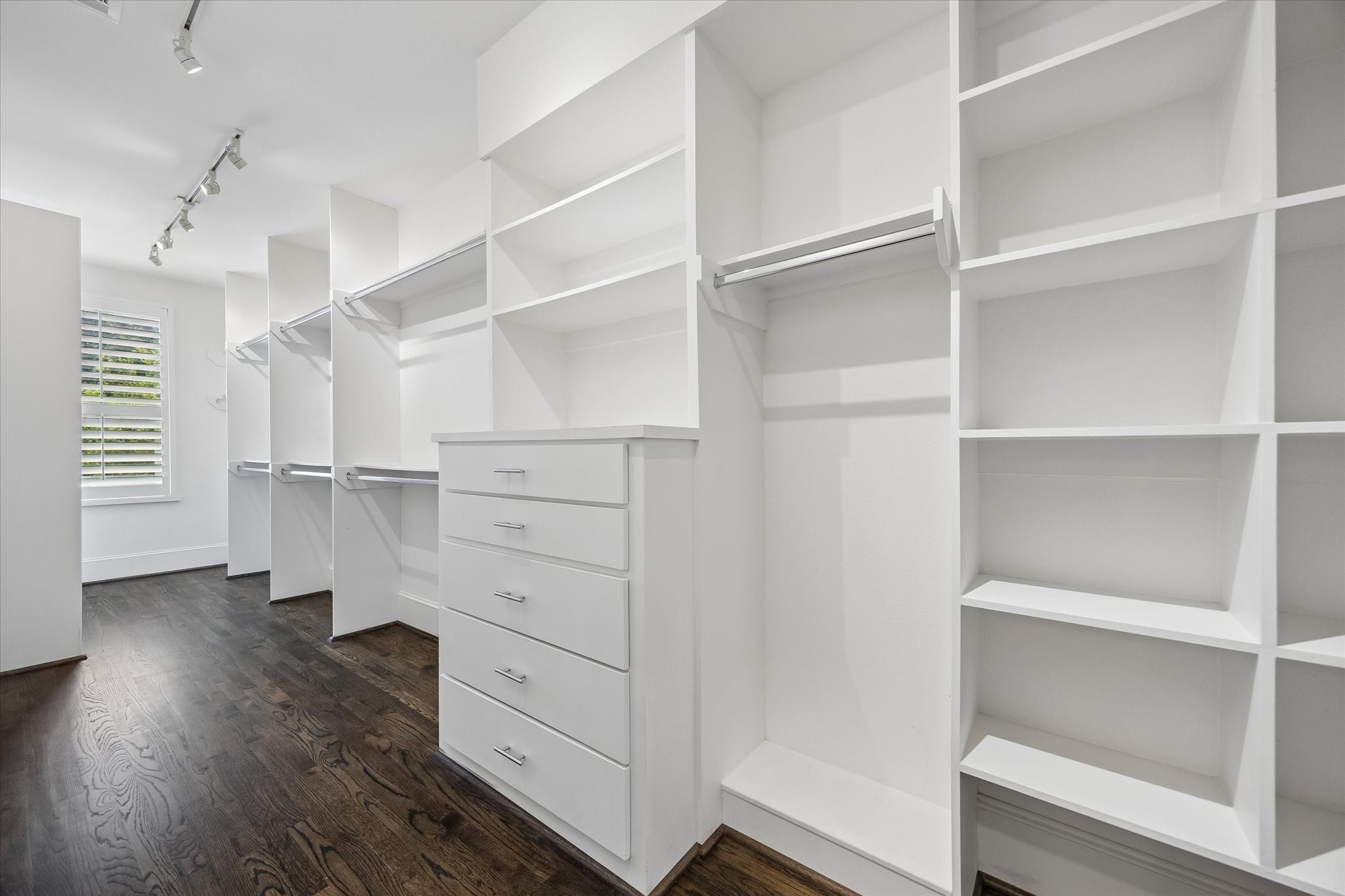 Huge walk-in closet with built-ins, offering exceptional storage and organization.