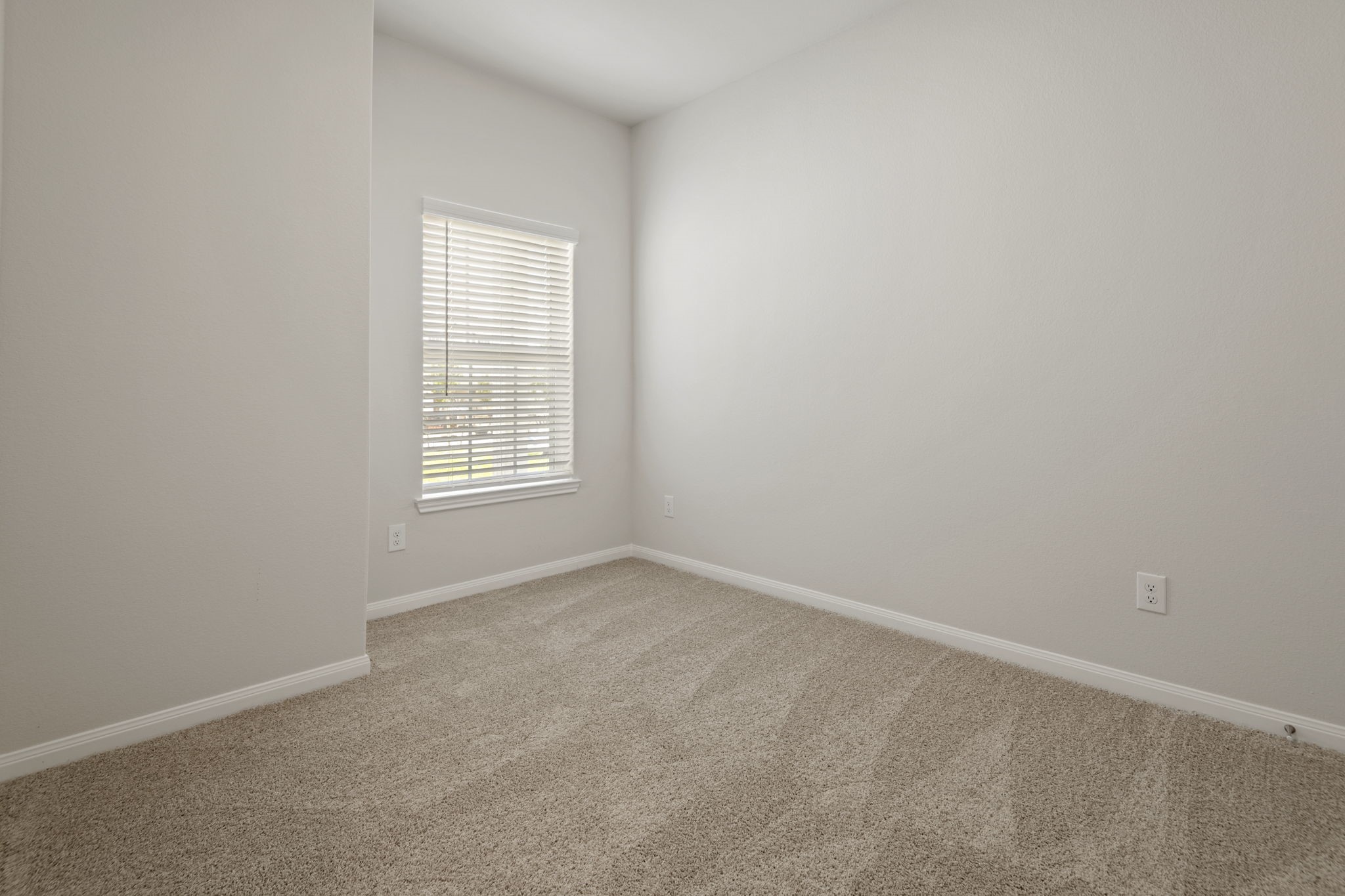 In addition to the primary suite, this home has three additional bedrooms.