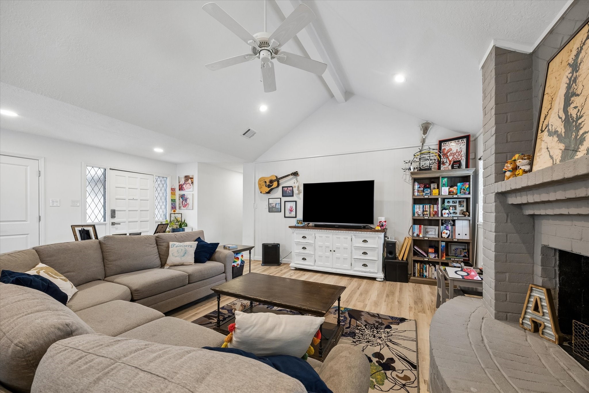 Living areas opened for more seamless flow. Note recessed lighting added throughout home!